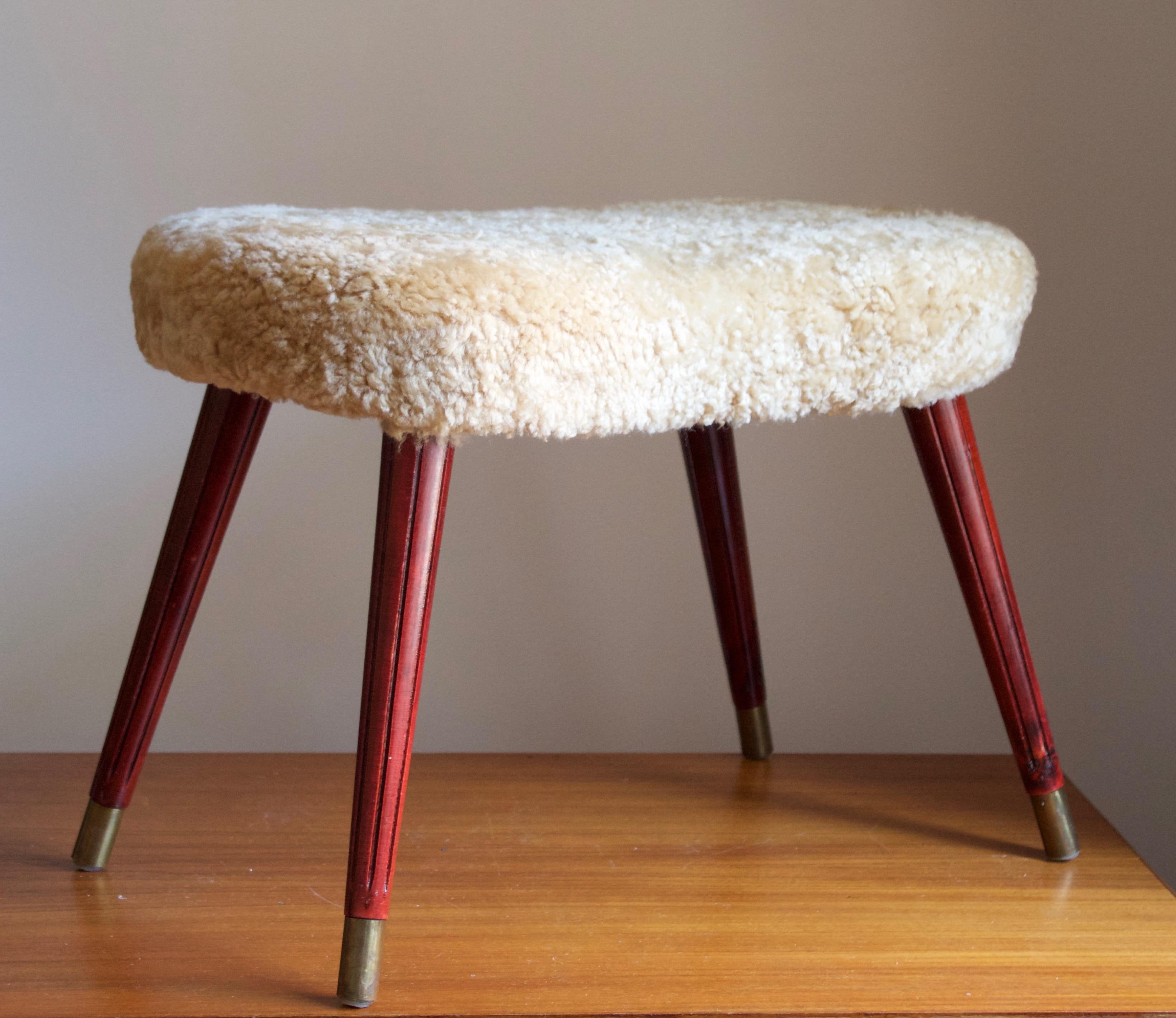 A stool in stained wood with carved fluted ornamentation, overstuffed seat reupholstered in brand new sheepskin upholstery. Produced in Sweden, 1950s.

Other designers of the period include Finn Juhl, Hans Wegner, Isamu Noguchi, Charlotte Perriand.