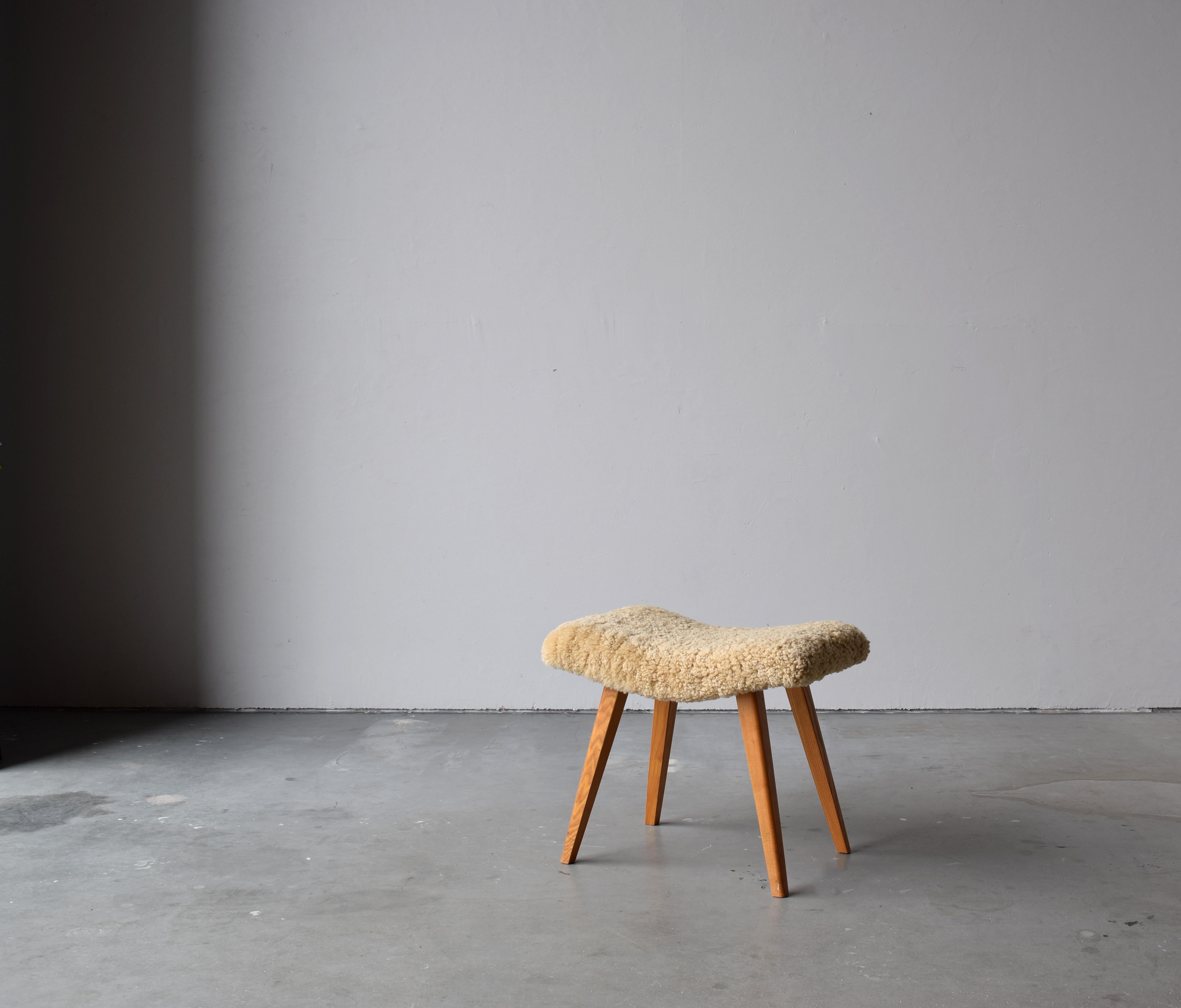 An organic stool in stained wood, overstuffed seat reupholstered in brand new sheepskin upholstery. Produced in Sweden, 1950s.

Other designers of the period include Finn Juhl, Hans Wegner, Isamu Noguchi, Charlotte Perriand.