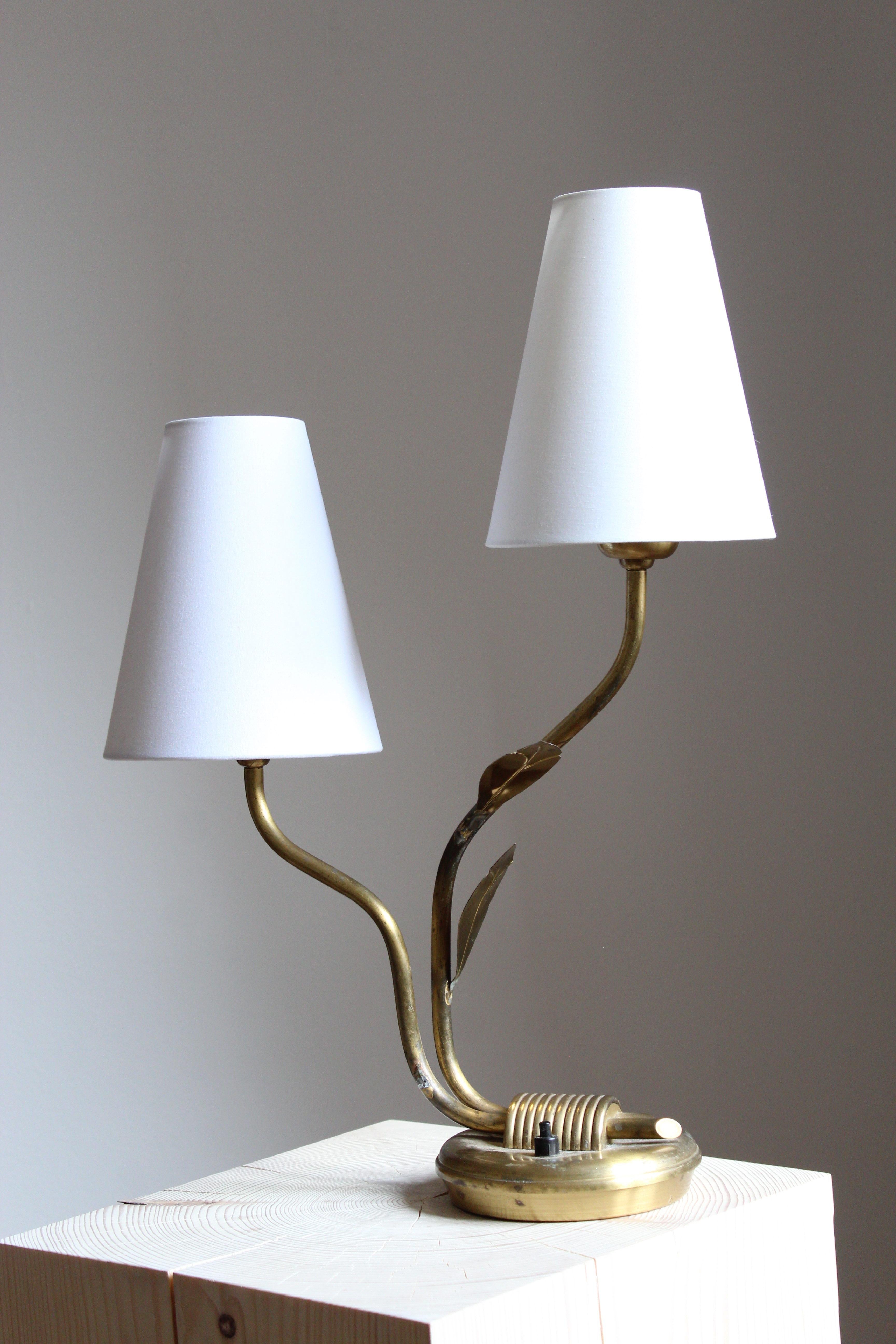 An organic table lamp. In brass. Brand new high-end fabric lampshade.

Other designers of the period include Josef Frank, Paavo Tynell, Hans Bergström, Böhlmarks, and Jean Royère.
