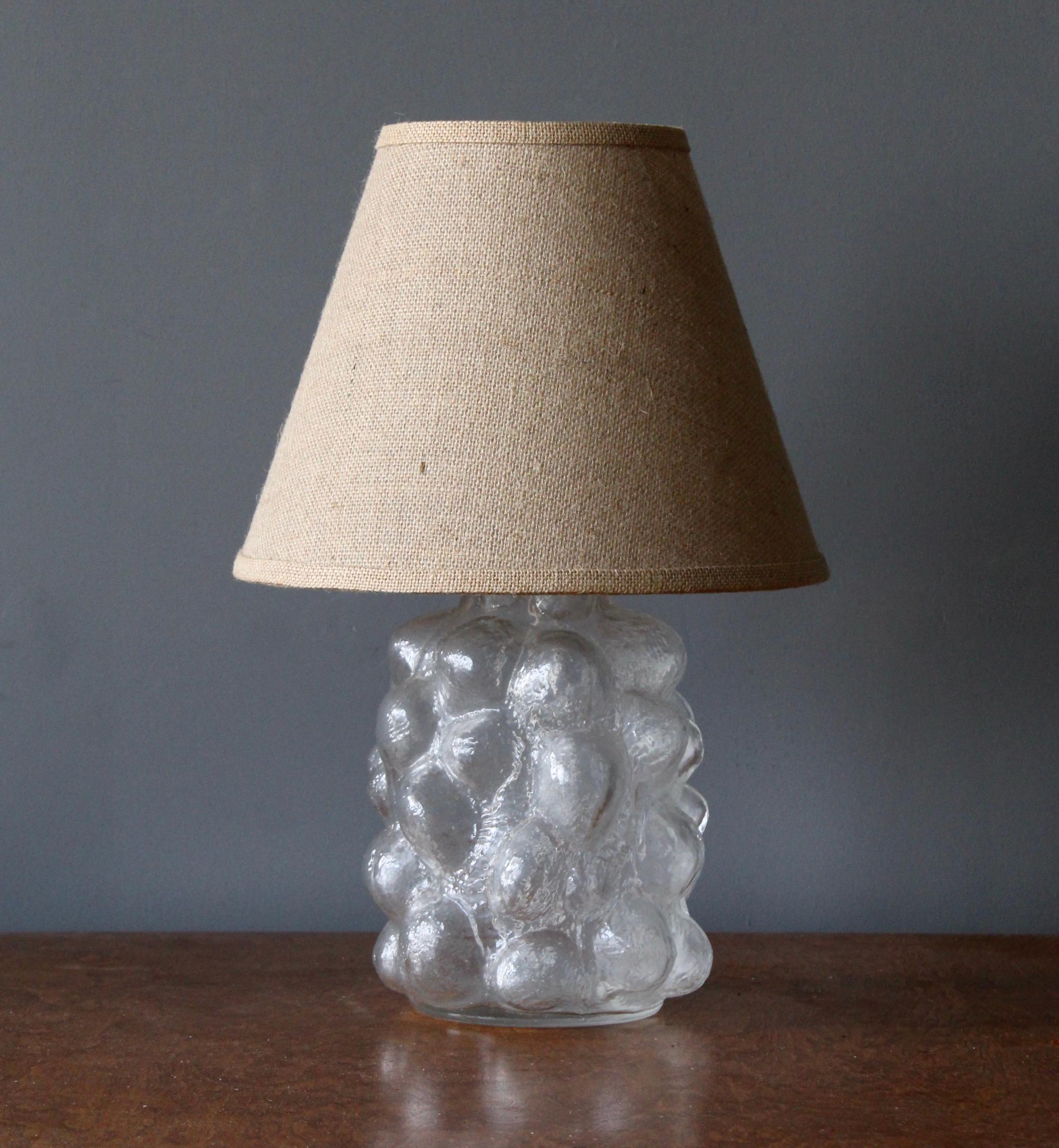 A table lamp in sculptured glass, By a Swedish unknown designer and maker, 1950s-1960s.

Stated dimensions excluding lampshade. Height includes socket. Sold without lampshade.