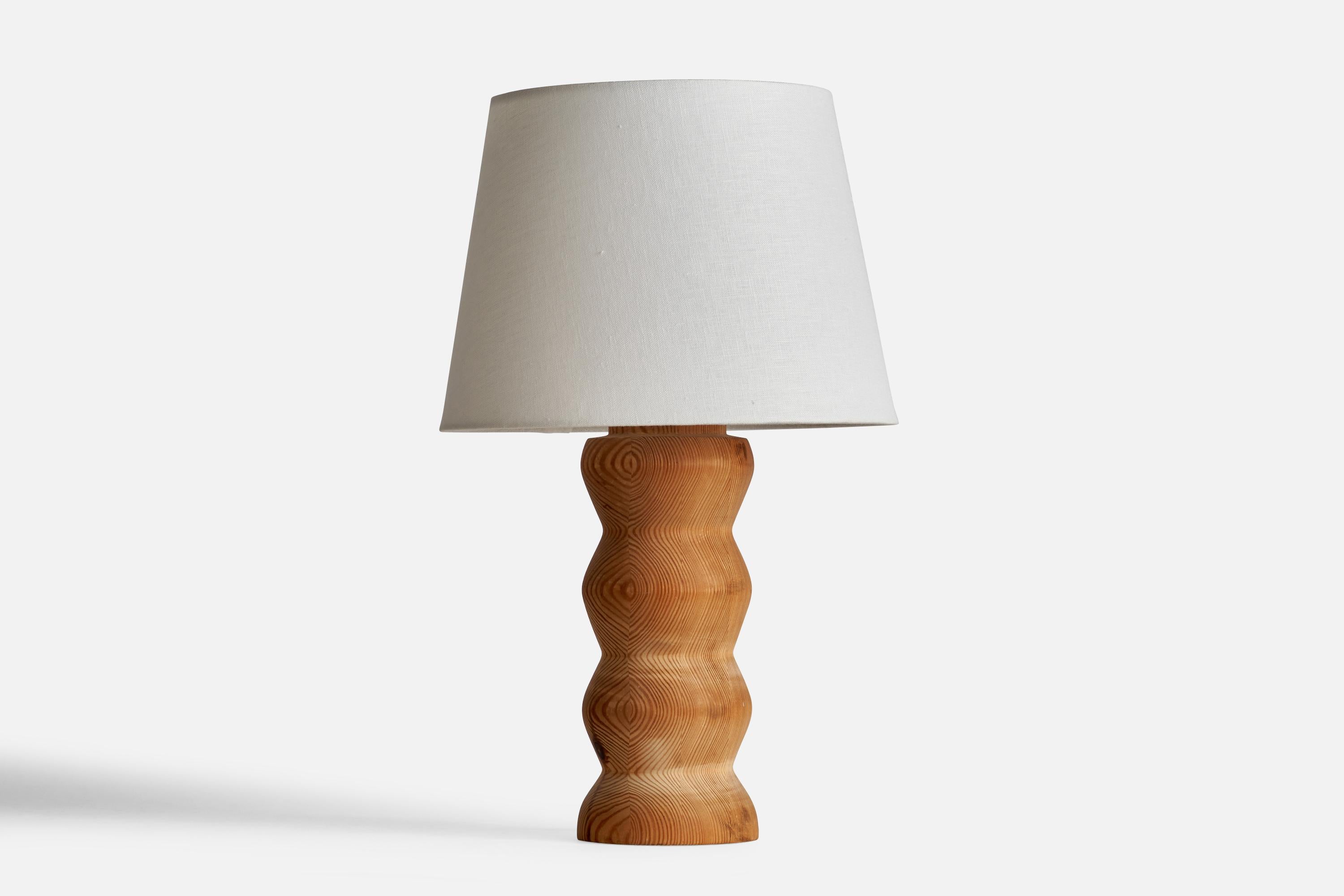 An organic pine table lamp designed and produced in Sweden, 1970s.

Dimensions of Lamp (inches): 14” H x 4.5”  Diameter
Dimensions of Shade (inches): 9” Top Diameter x 12”  Bottom Diameter x 8.75” H
Dimensions of Lamp with Shade (inches): 19.5” H x