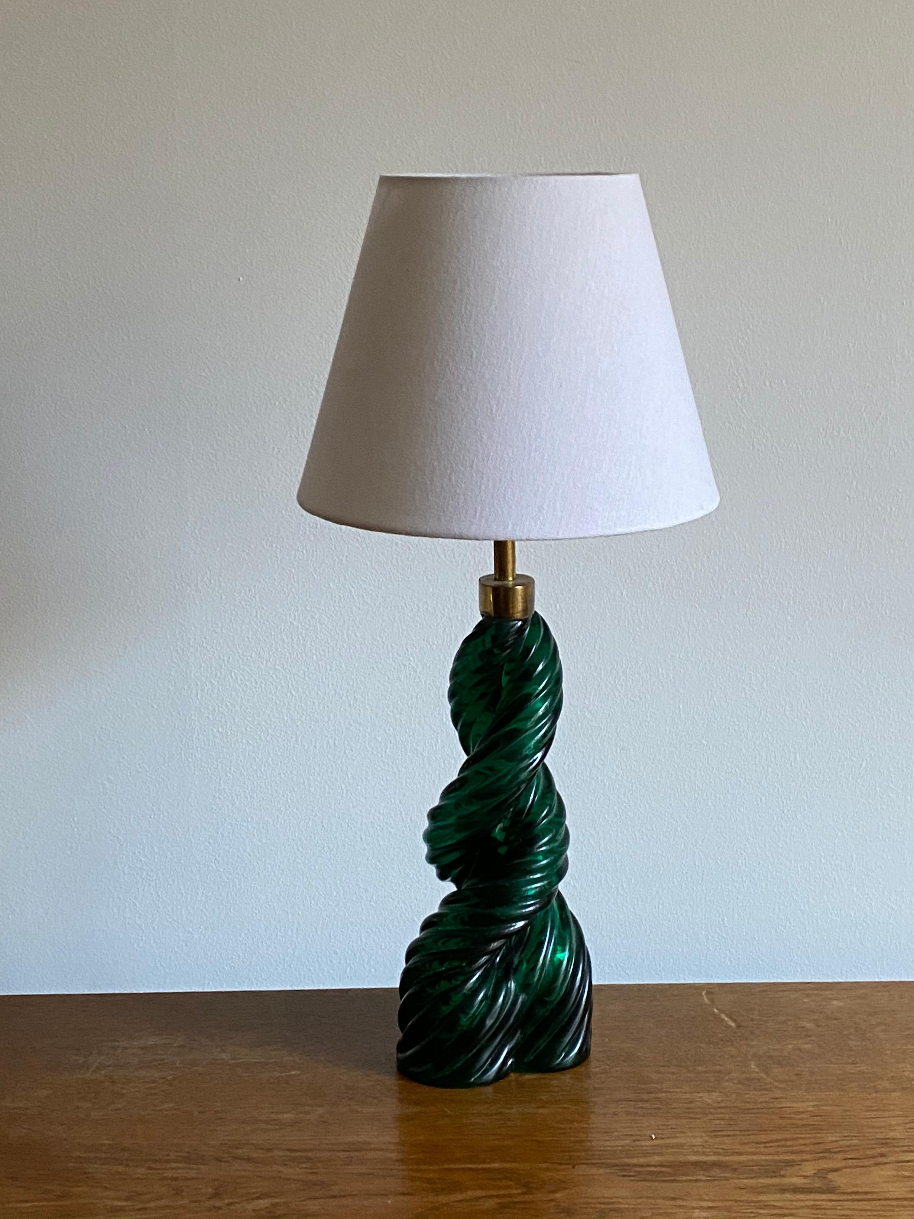 An organic table lamp. Designed Paolo Venini & Carlo Scarpa. In green colored glass and brass. Italy, 1930s

Lampshade is not included in the purchase, stated dimensions are without the lampshade. 

Other lighting designers of the period include