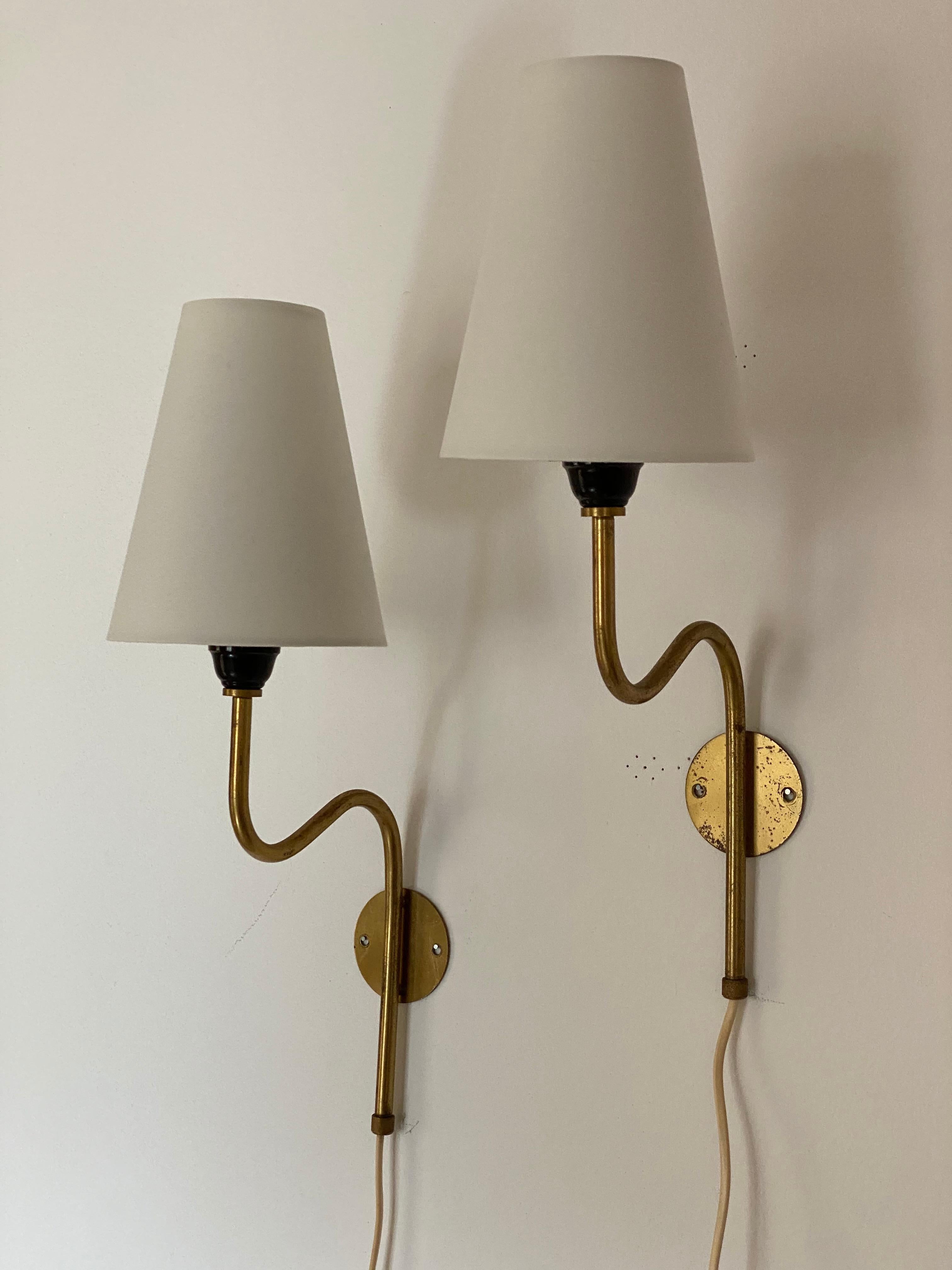 A pair of organic wall lamps / sconces. Designed and produced in Sweden, 1940s. Brand new high-end lampshades. 

Other designers of the period include Paavo Tynell, Hans Bergström, Hans Agne Jakobsson, Alvar Aalto, and Lisa Johansson-Pape.