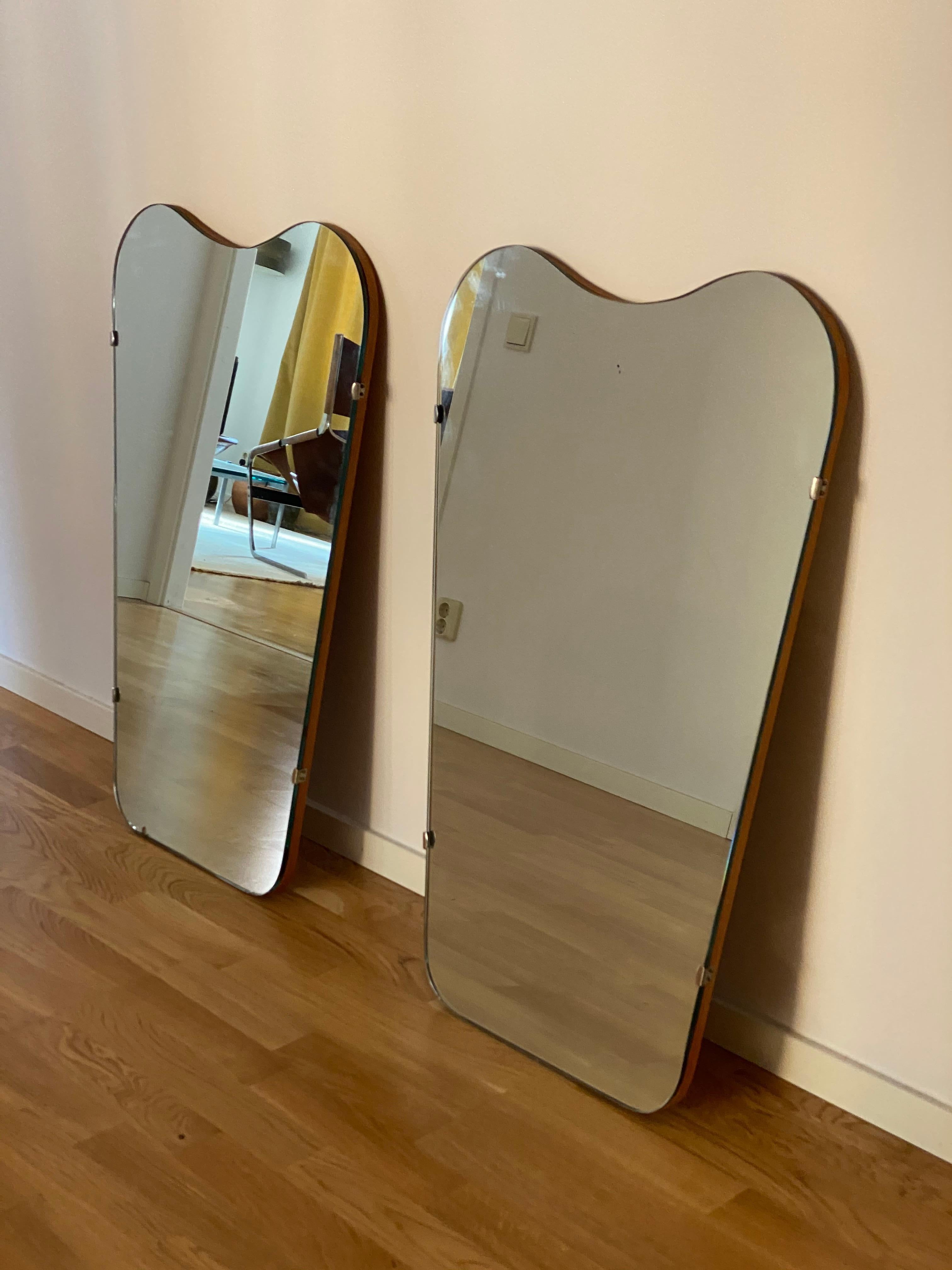 A pair of sizable organic wall mirrors. Designed and produced in Sweden, 1950s. 

