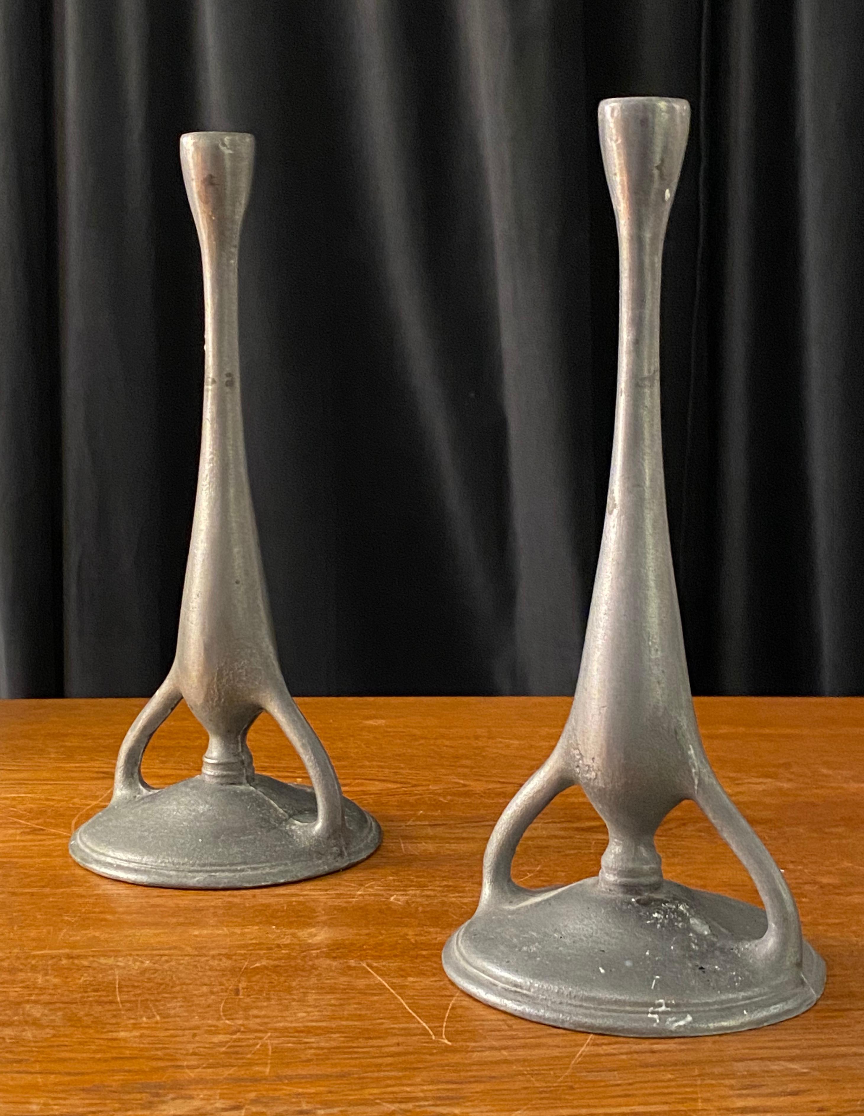 A pair of organic candlesticks. Produced in Sweden 1930s. In solid pewter. 

 