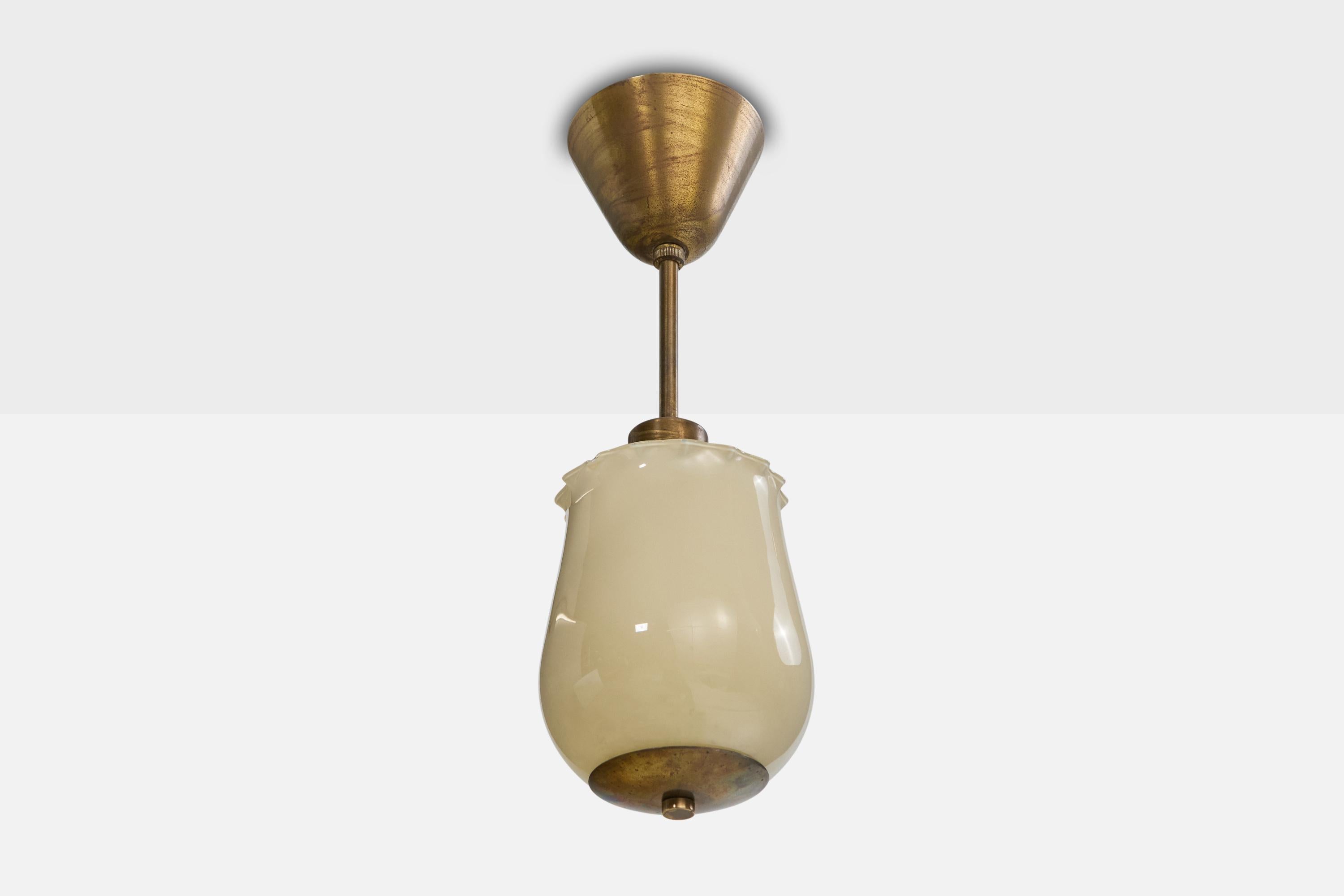 A brass and off-white opaline glass pendant light designed and produced in Sweden, c. 1940s.

The brass stem, socket and canopy presents with moderate oxidation.

Overall Dimensions (inches): 14.5” H x 5” Diameter

Dimensions of Canopy: 3.25“ H x