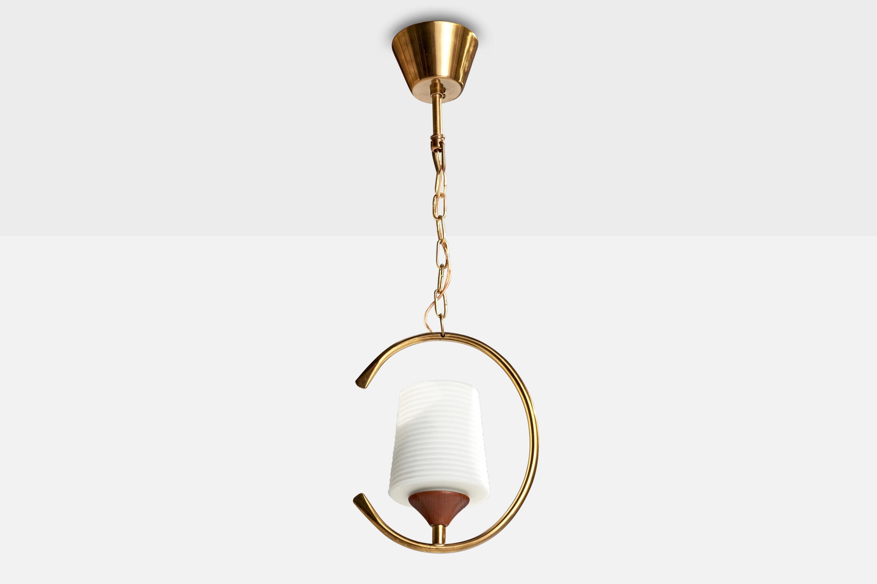 A brass, teak and white opaline glass pendant designed and produced in Sweden, c. 1950s.

Overall Dimensions (inches): 20” H x 7.5” Diameter

Dimensions of Canopy:  2.5” H x 3.5” W x 3.5” D

Chain length: 8” H

Bulb Specifications: E-26  

Number of
