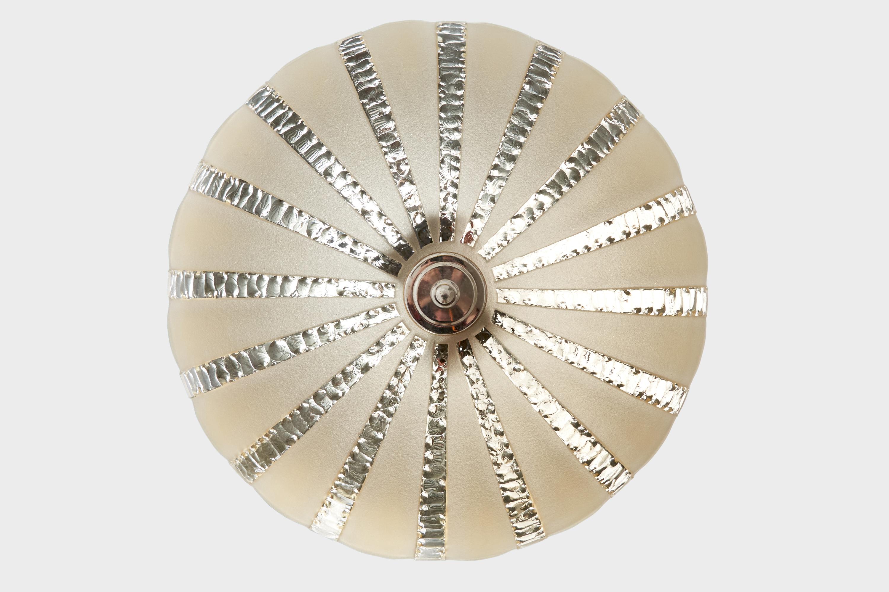A metal and glass pendant light designed and produced in Sweden, c. 1930s.

Overall Dimensions (inches): 13.125” H x  20” Diameter

Dimensions of Canopy:  2” H x 3.5” diameter

Stem length: 7.75” H

Bulb Specifications: E-26 

Number of Sockets: