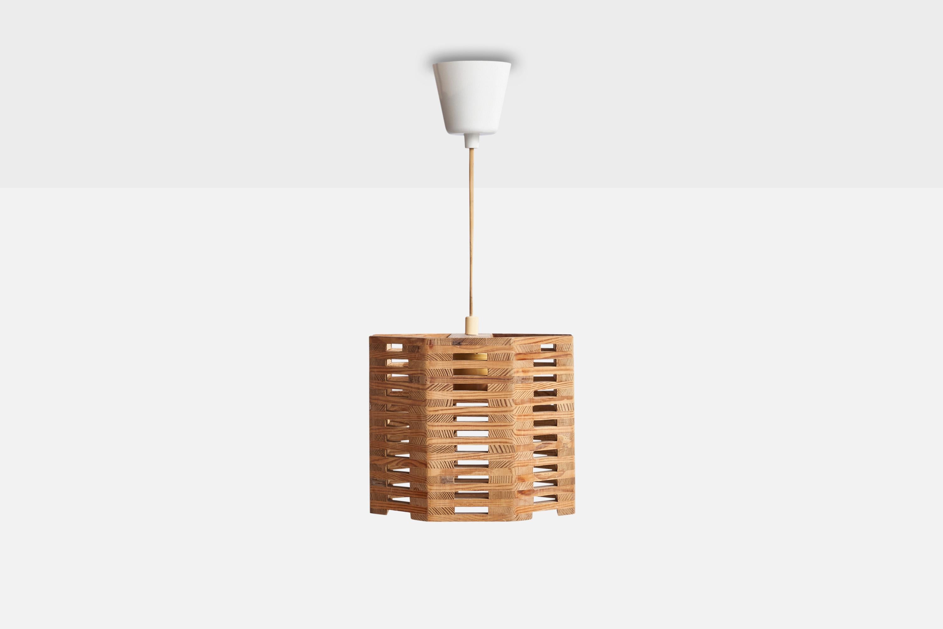 A pine pendant light designed and produced in Sweden, 1970s.

Dimensions of canopy (inches): 3”  H x 3.5” Diameter
Socket takes standard E-26 bulbs. 1 socket.There is no maximum wattage stated on the fixture. All lighting will be converted for US