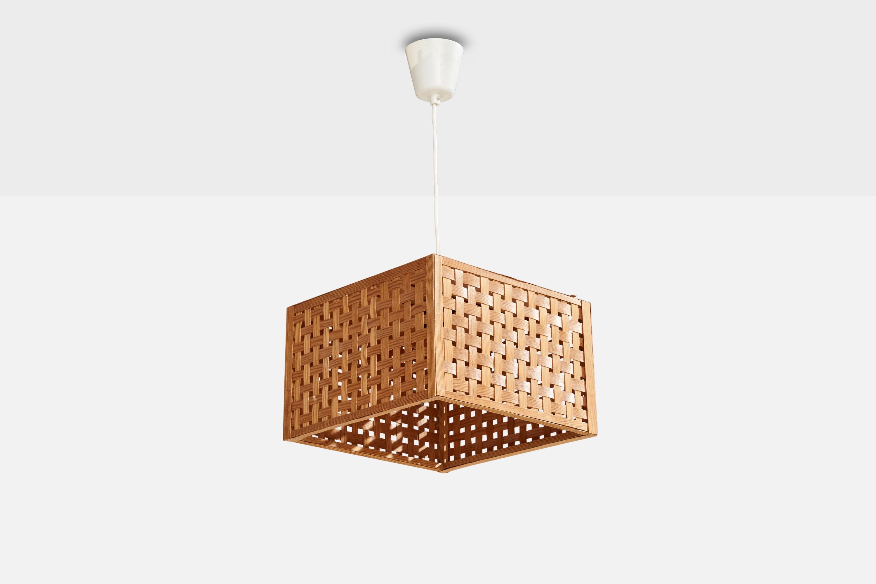 A pine and pine veneer pendant light designed and produced in Sweden, c. 1970s.

Dimensions of canopy (inches): 3.34” H x 3.6” Diameter
Socket takes standard E-26 bulbs. 1 socket.There is no maximum wattage stated on the fixture. All lighting will