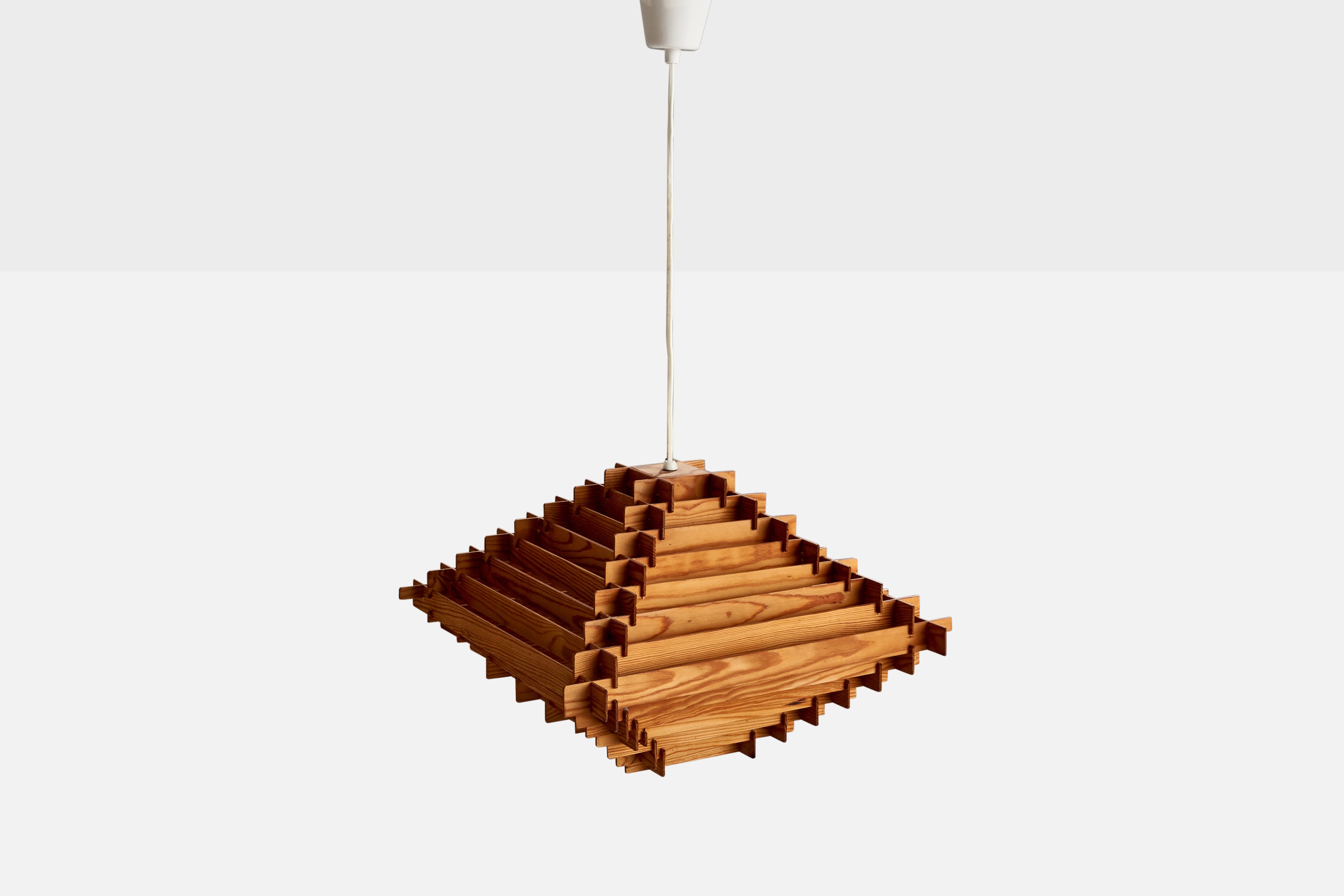 A pine pendant designed and produced in Sweden, c. 1960s.

Dimensions of canopy (inches): 3.53” H x 3.32” Diameter
Socket takes standard E-26 bulbs. 1 socket.There is no maximum wattage stated on the fixture. All lighting will be converted for US
