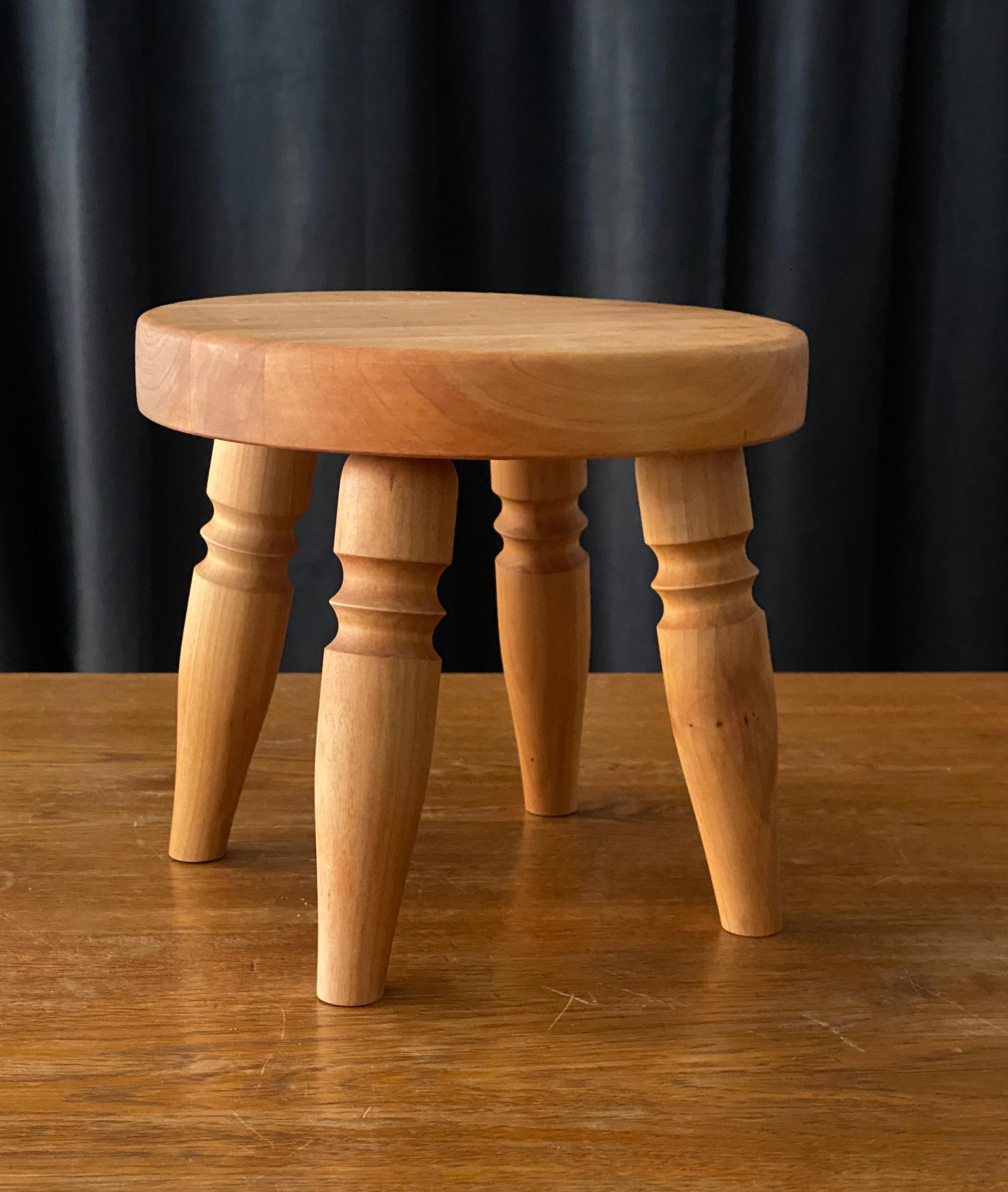 A very petit Minimalist stool, designed and produced in Sweden, 1970s. In pine with original lacquer. Finely carved details to legs. Can function as a piece of decor, side table, or to place a planter or vase atop. 

Other designers of the 20th