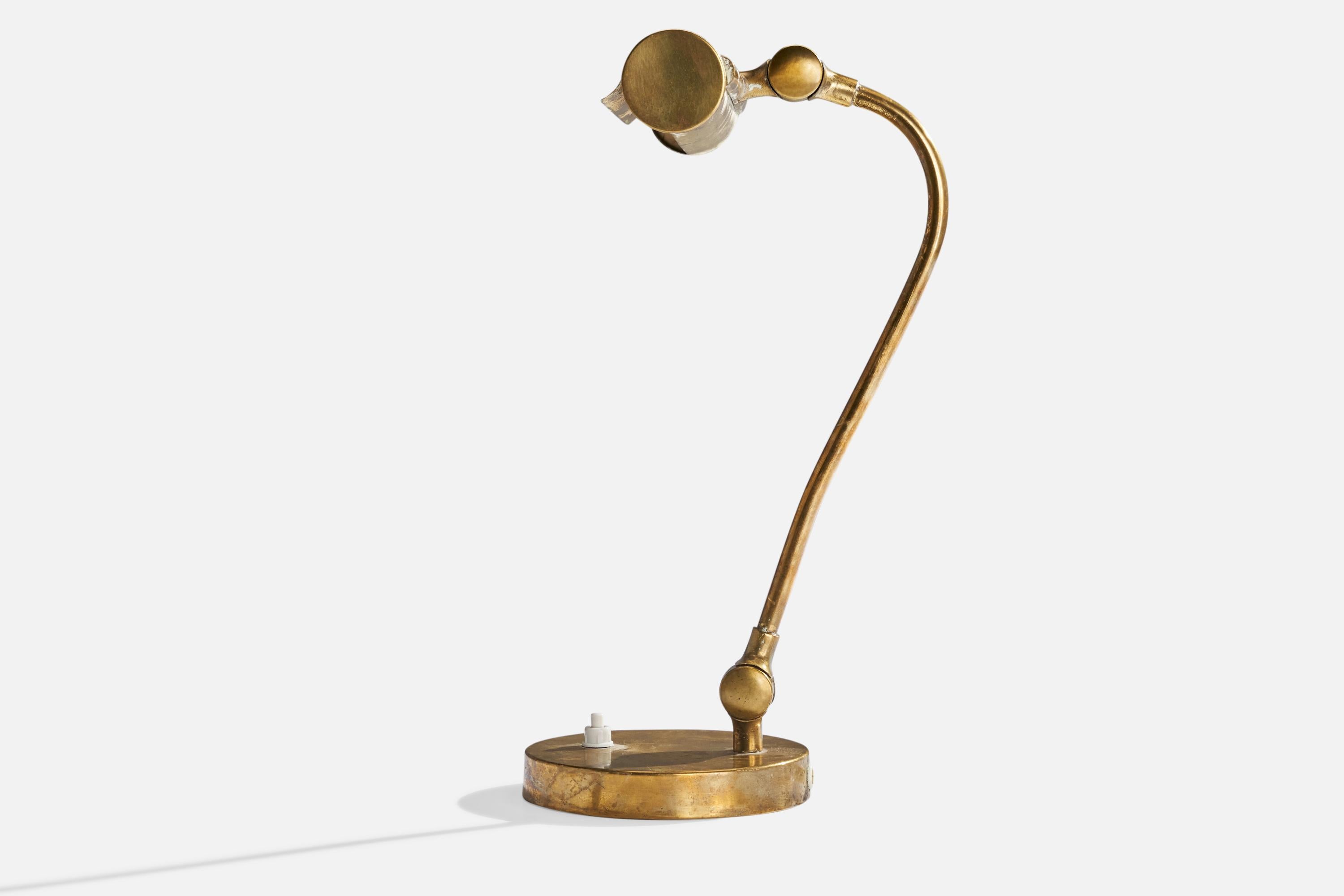 An adjustable brass piano lamp or table lamp designed and produced in Sweden, c. 1940s.

Overall Dimensions (inches): 12” H x 8” W x 9” D
Stated dimensions include shade.
Bulb Specifications: E-14 Bulb
Number of Sockets: 1
All lighting will be