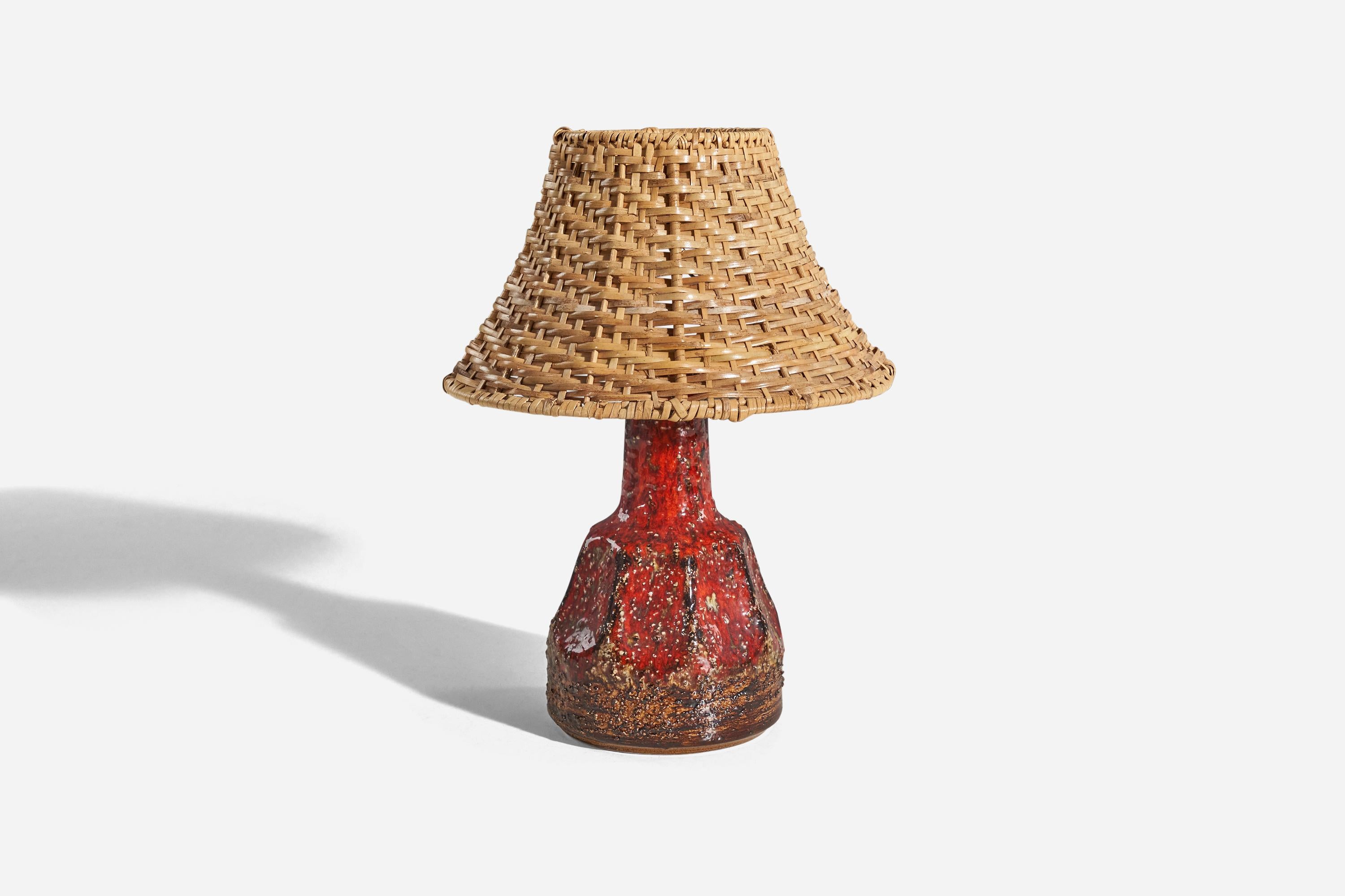 A red, glazed stoneware table lamp designed and produced in Sweden, c. 1960s. 

Sold without lampshade. 
Dimensions of lamp (inches) : 10 x 4.79 x 4.79 (H x W x D)
Dimensions of shade (inches) : 4 x 8.75 x 5.5 (T x B x S)
Dimension of lamp with