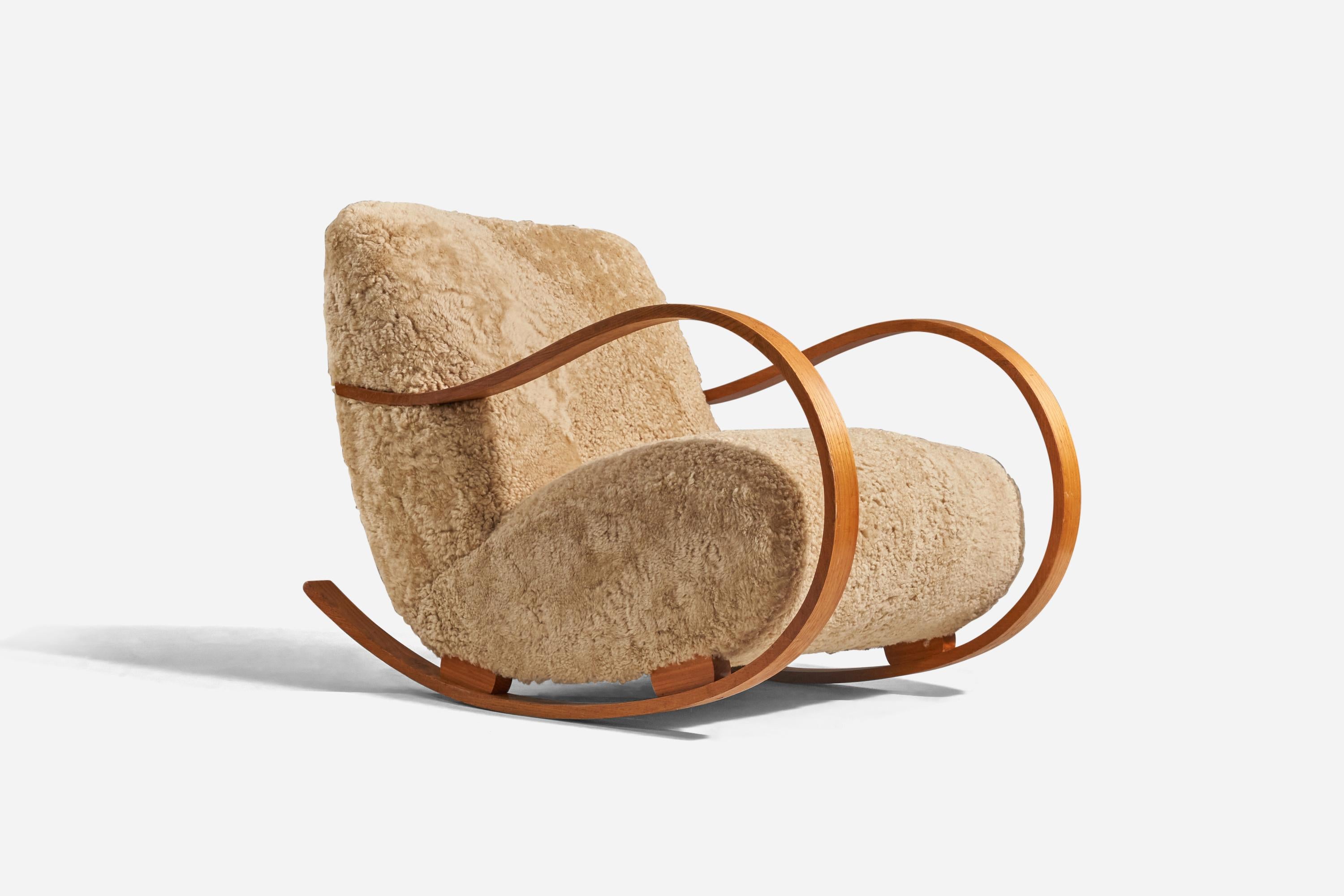 A bentwood and sheepskin rocking lounge chair designed and produced in Sweden, 1940s. 
 