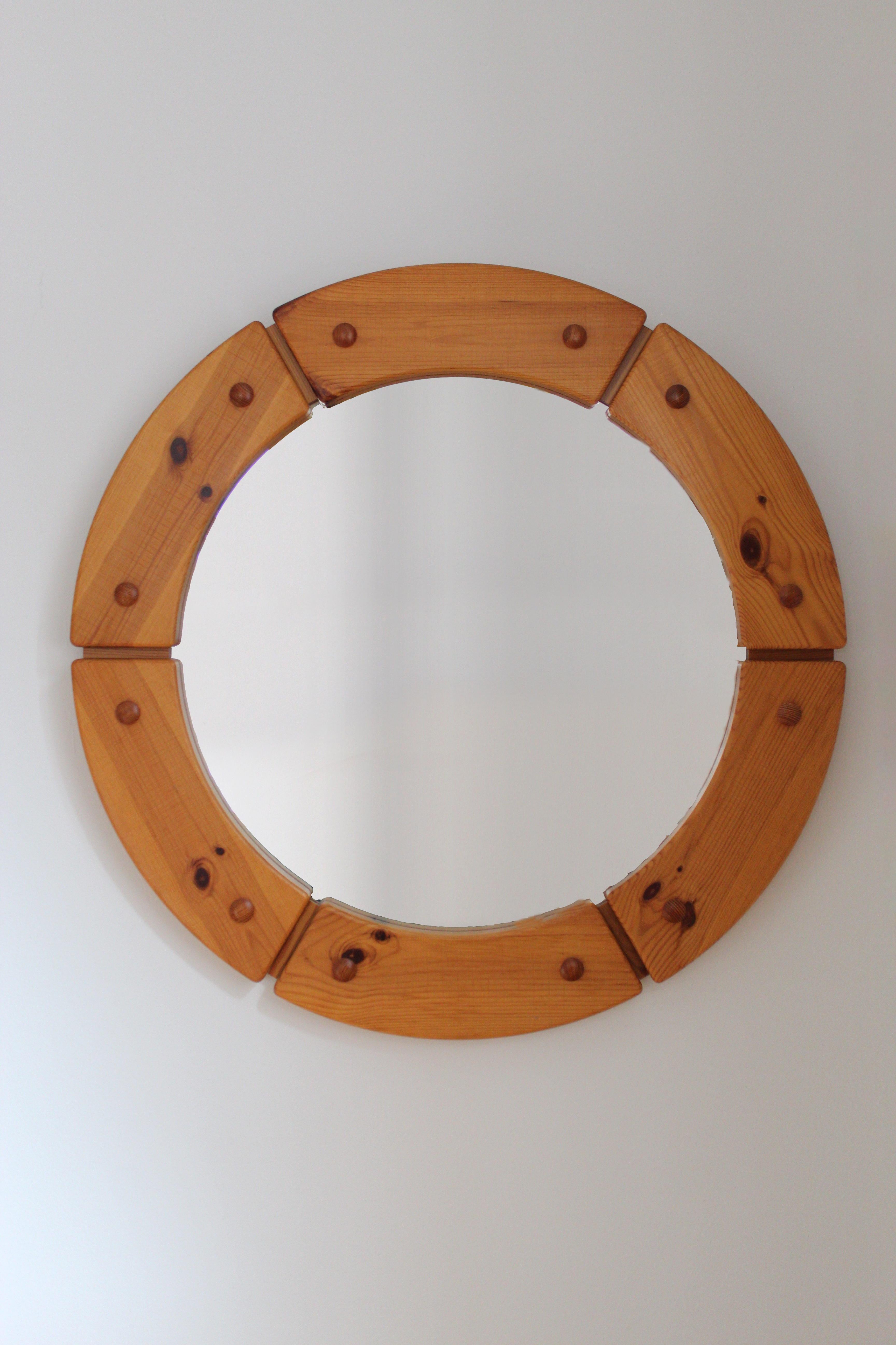 A sculptural and sizable round wall mirror, Sweden, 1960s. 

Other designers of the period include Axel Einar Hjorth, Roland Wilhelmsson, Charlotte Perriand, Pierre Chapo, and Yasha Heifetz.
