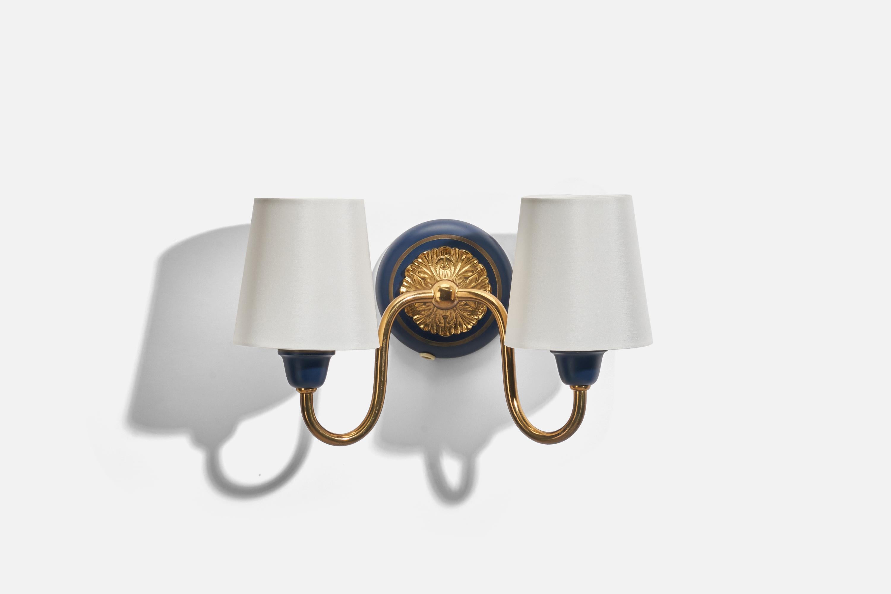 A pair of blue lacquered metal, brass and fabric sconces designed and produced in Sweden, 1950s. 

Sold with Lampshades. Dimensions stated are of Sconces with Lampshades.

Dimensions of Back Plate (inches) : 4 x 4 x 0.65 (Height x Width x