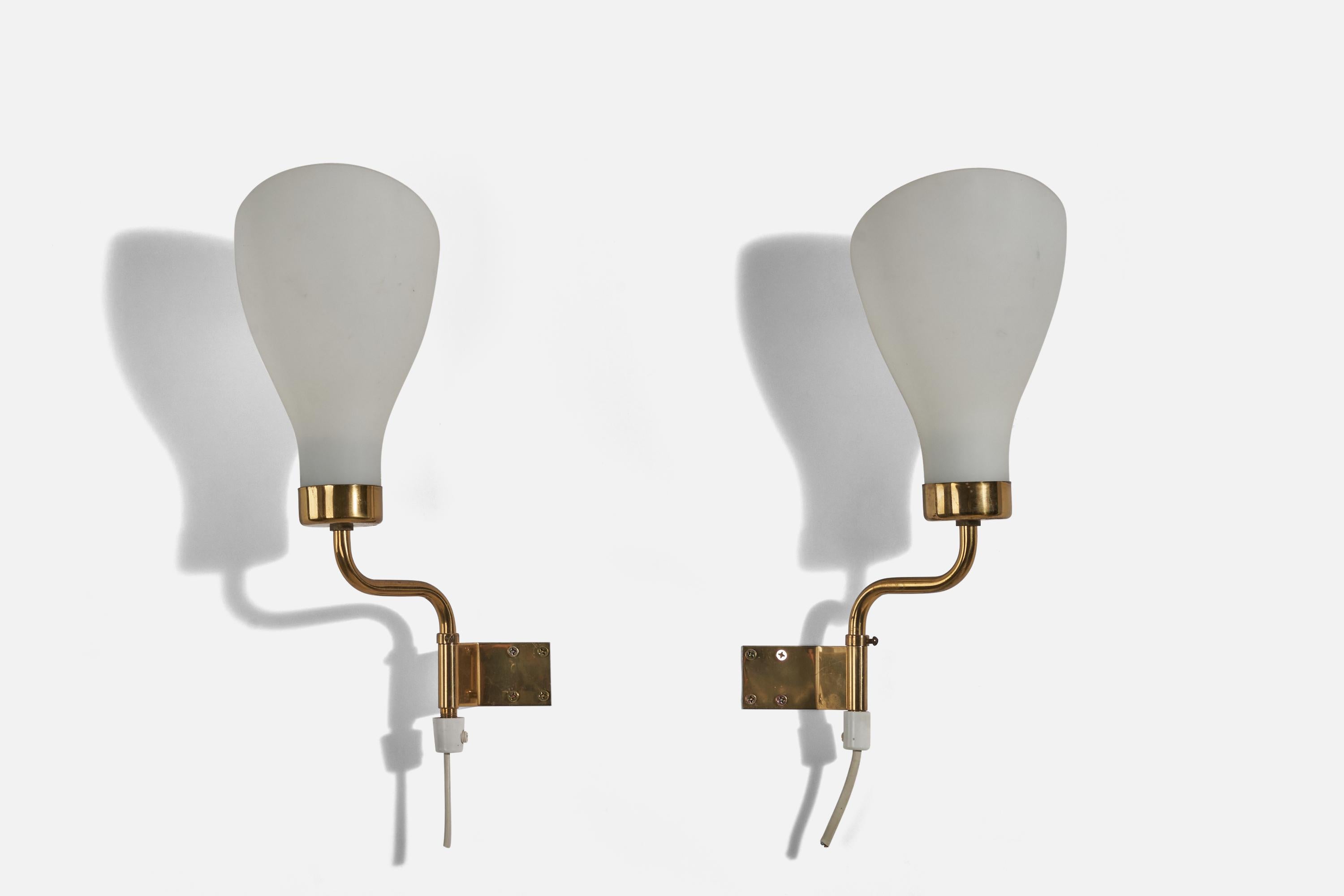 A pair of brass and glass sconces / wall lights designed and produced in Sweden, c. 1940s.

Dimensions of Back Plate (inches) : 1.4 x 2.5 x 0.04 (Height x Width x Depth).

Socket takes E-14 bulb.

There is no maximum wattage stated on the
