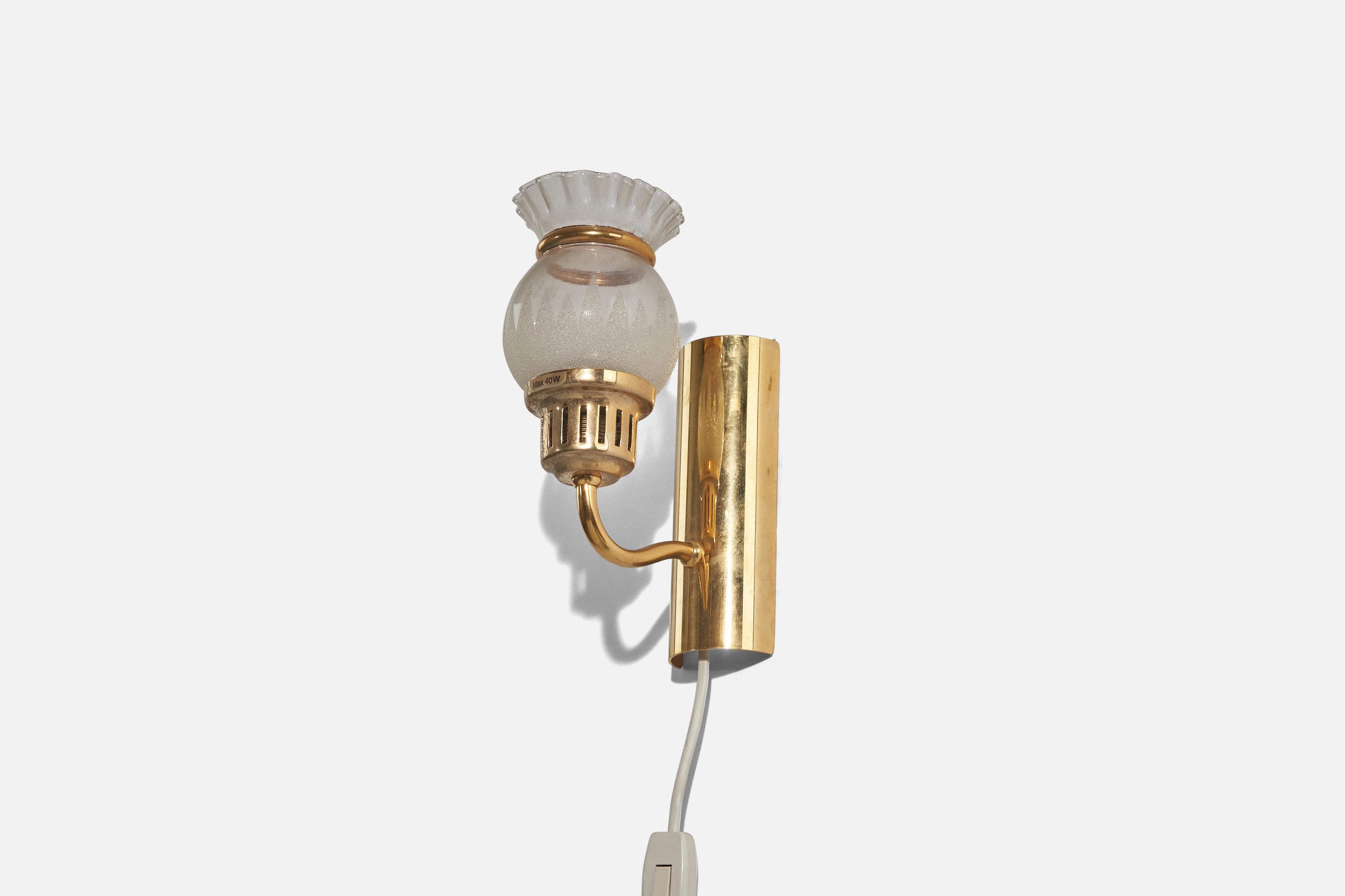 A pair of brass and glass sconces designed and produced in Sweden, circa 1970s. 

Dimensions of back plate (inches) : 6.5 x 2.37 x 1.06 (Height x Width x Depth).

Socket takes E-14 bulb.
There is no maximum wattage stated on the fixture.