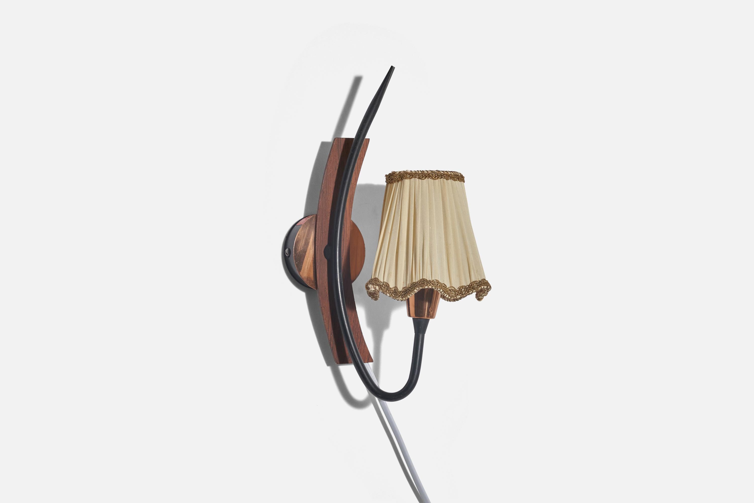 A pair of teak, metal, copper and fabric sconces/ wall lights designed and produced in Sweden, c. 1960s. 

Sold with Lampshade. 
Stated dimensions refer to the Sconce with the Shade. 
Dimensions of back plate (inches) : 2.37 x 2.37 x 0.80 (H x W
