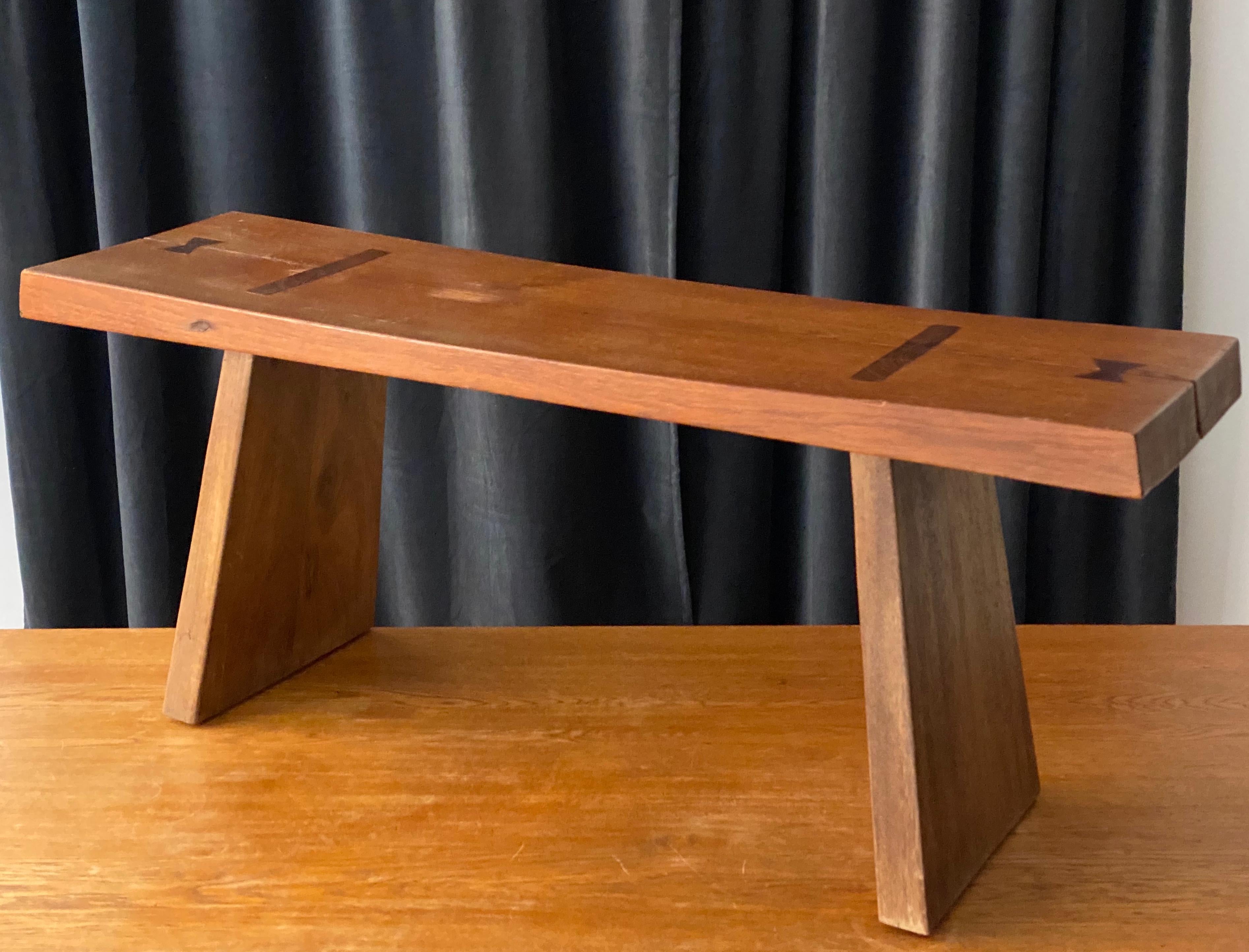 A sculptural Minimalist bench. In sold stained oak. Features beautifully revealed joinery, and dovetail keys, similar to the butterfly joints used by George Nakashima.

Other designers of the period include Roland Wilhelmsson, Pierre Chapo, and