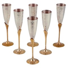 Retro Swedish designer. Set of six champagne glasses in brass and silver-plated brass