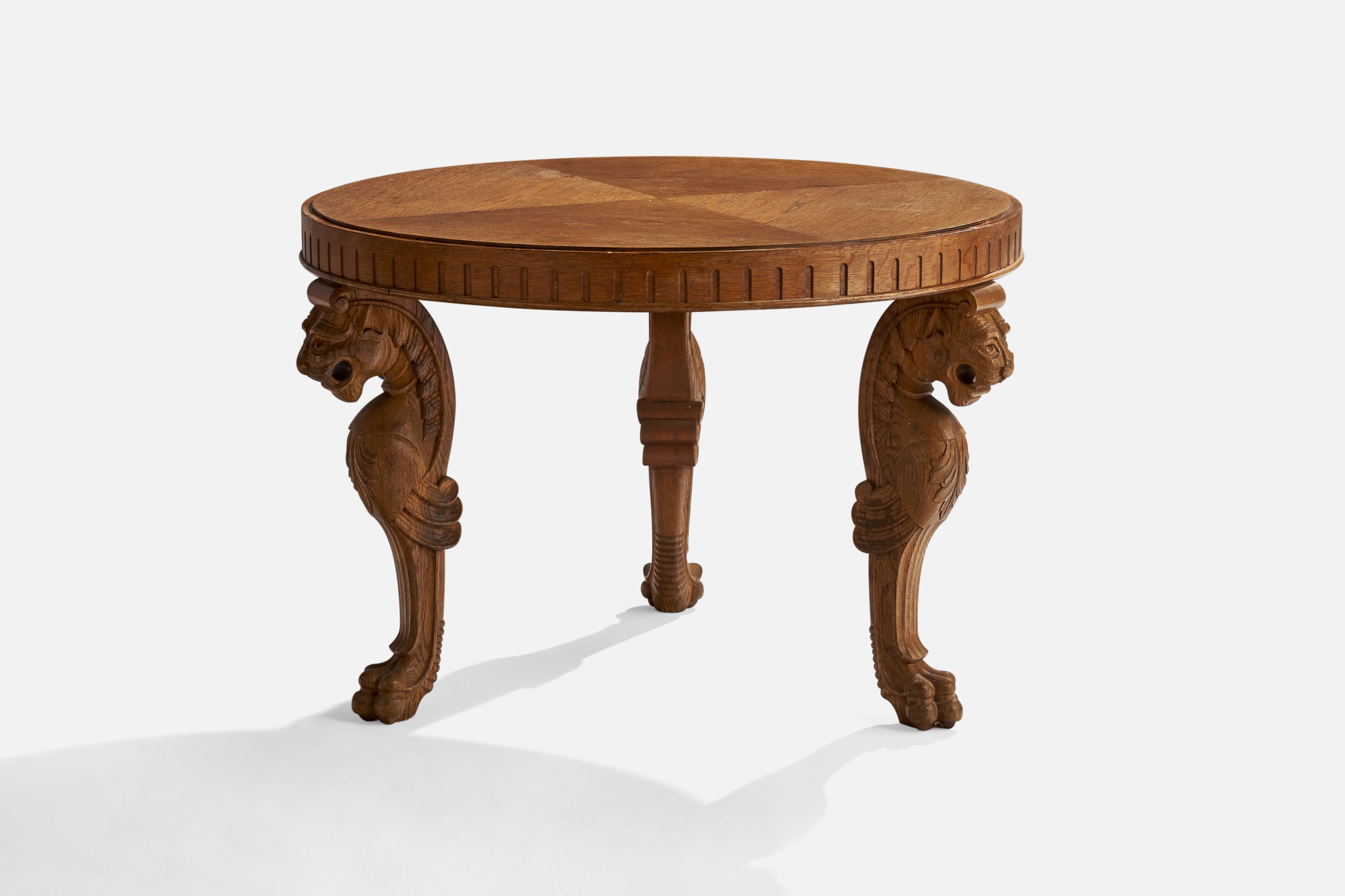 A carved and veneered elm side table or coffee table designed and produced in Sweden, 1920s.