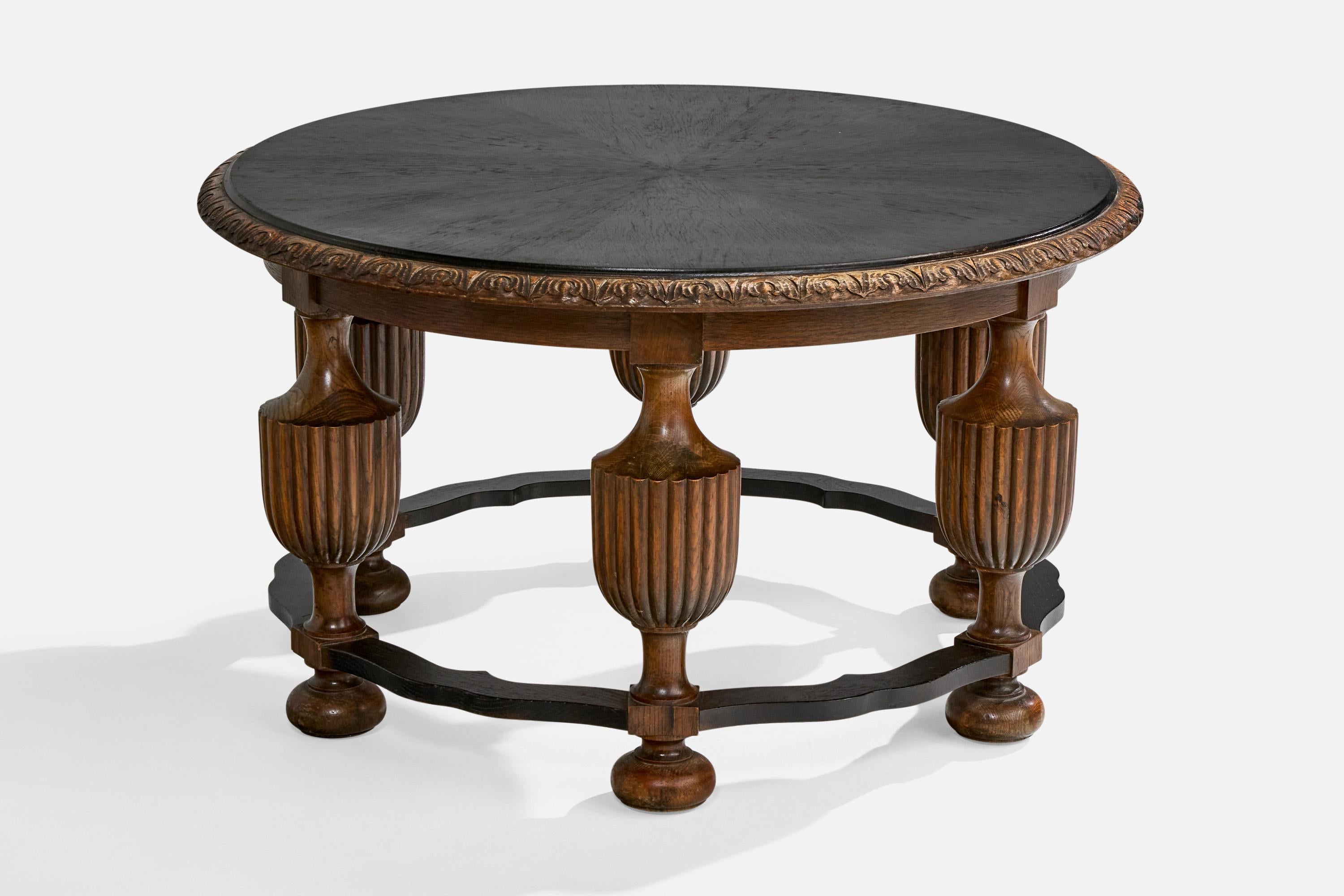A dark-stained and blackened oak side table or center table designed and produced in Sweden, c. 1930s.

Overall Dimensions (inches): 21.75