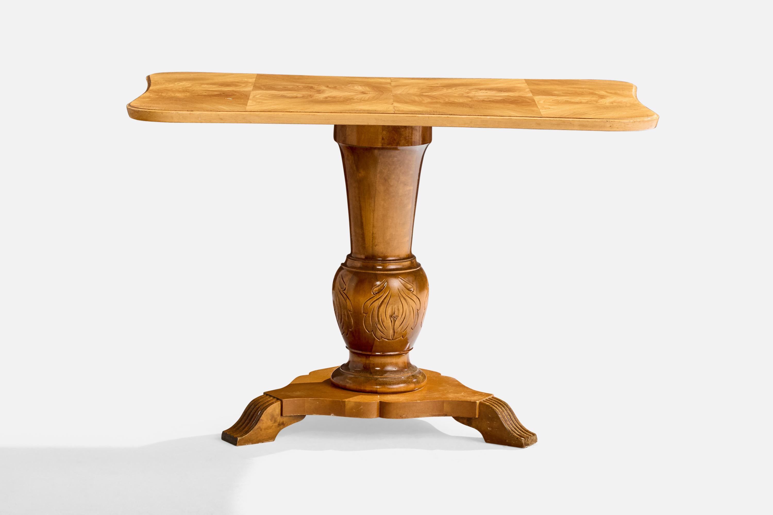 A wood side table designed and produced in Sweden, c. 1930s.

Overall Dimensions (inches): 24.0