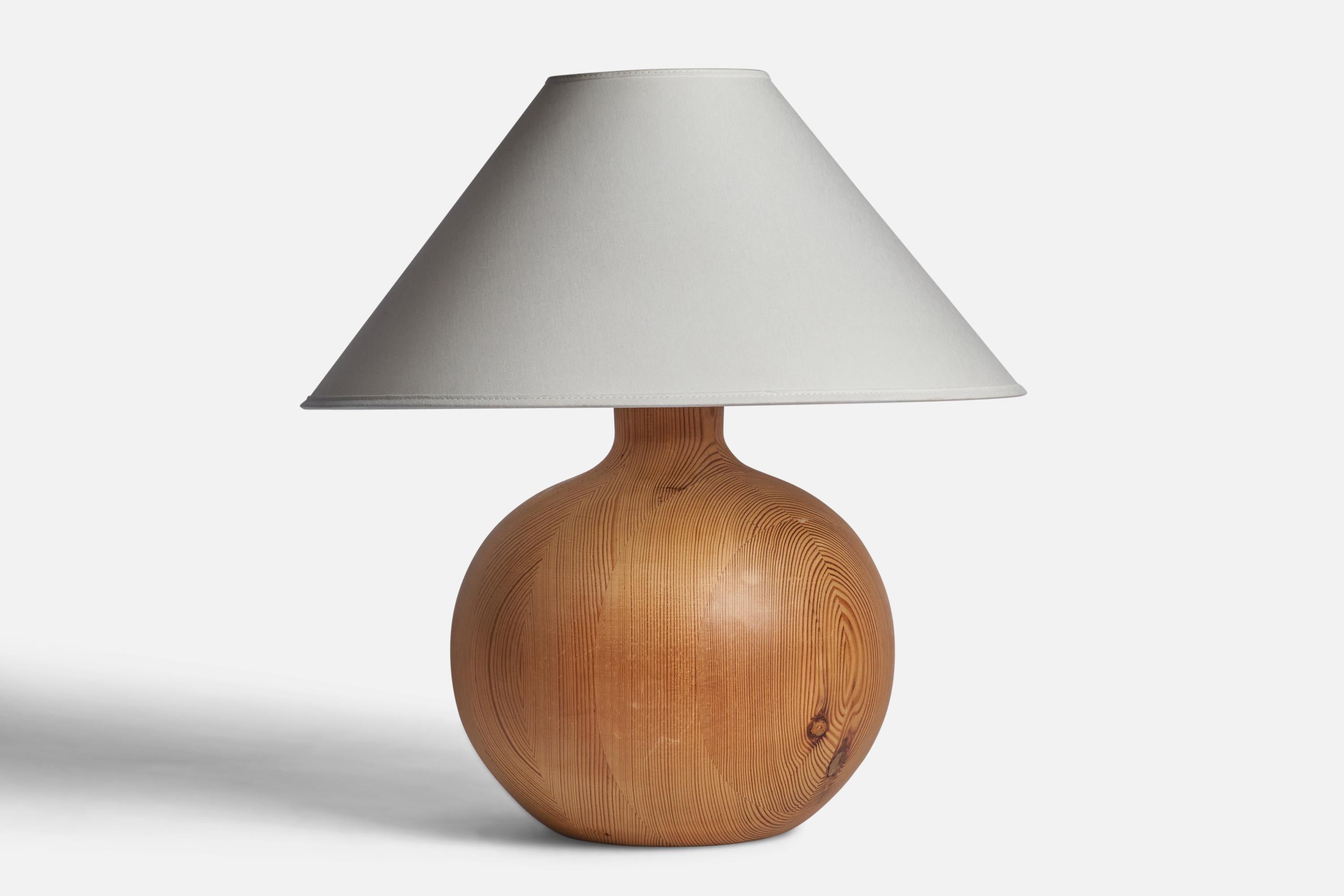 A sizeable pine table lamp designed and produced in Sweden, c. 1960s.

Dimensions of Lamp (inches): 11.75” H x 9.25” Diameter
Dimensions of Shade (inches): 4.5” Top Diameter x 16” Bottom Diameter x 7.25” H
Dimensions of Lamp with Shade (inches):
