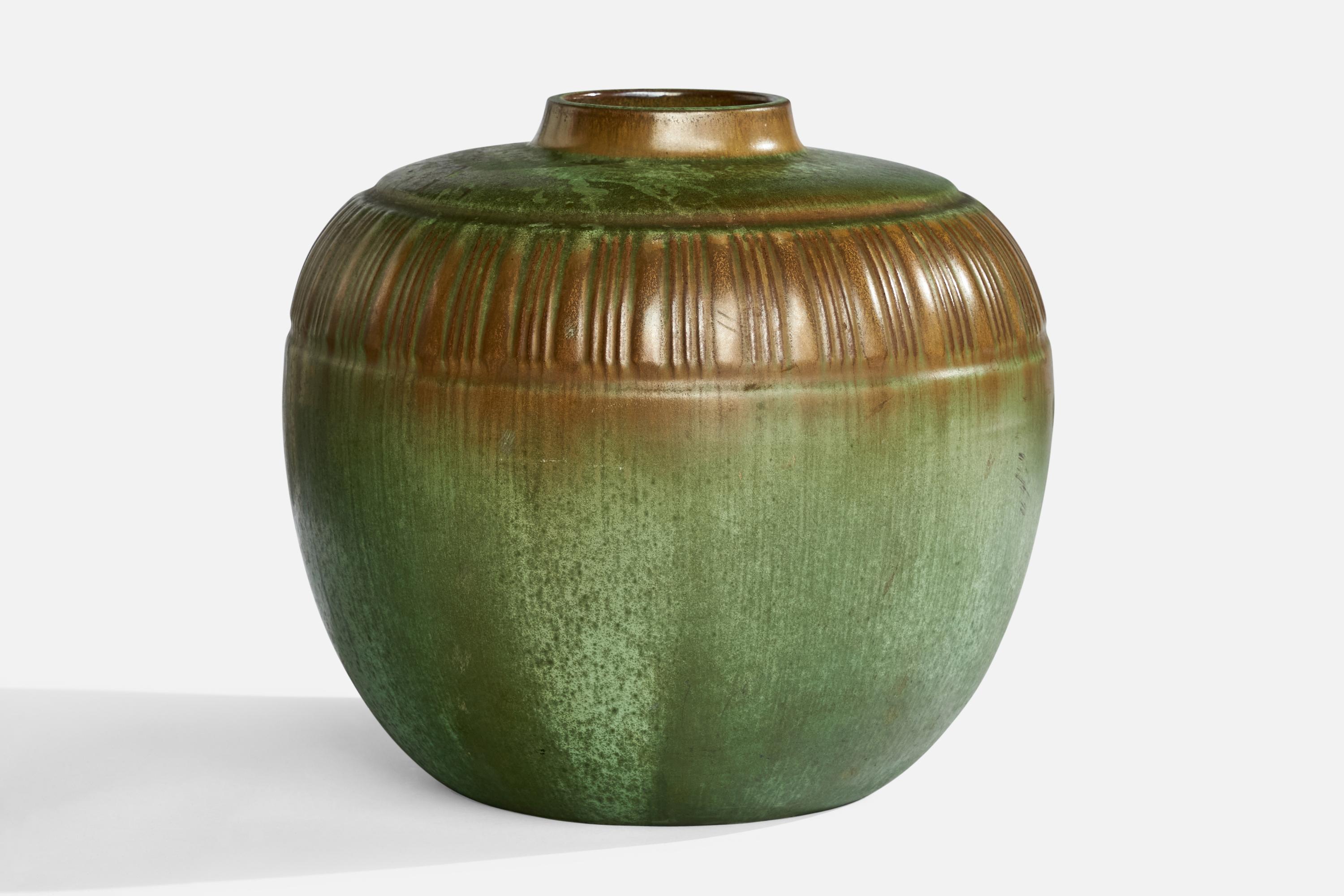 A green and brown-glazed incised vase designed and produced in Sweden, 1930s.
