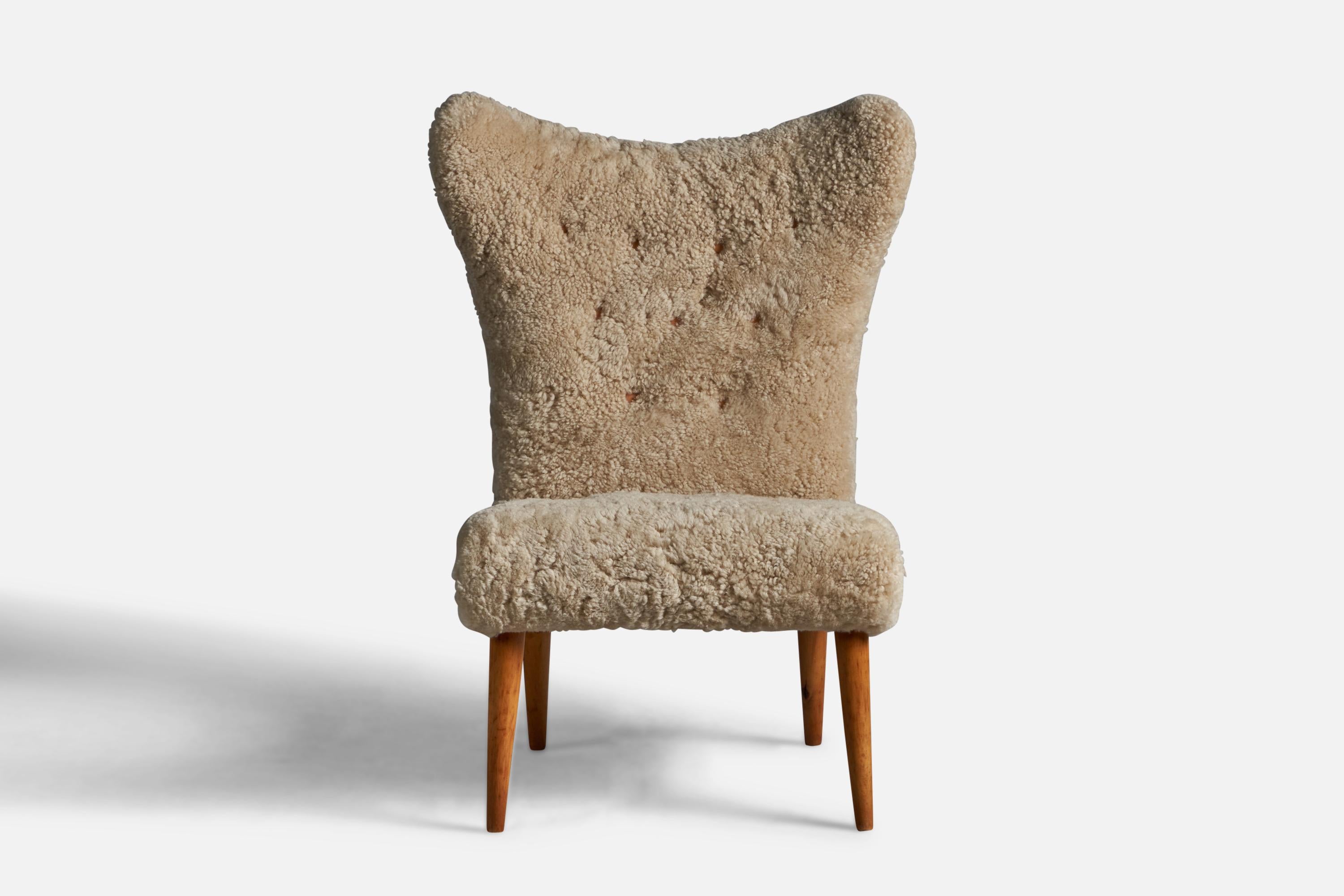 Mid-Century Modern Swedish Designer, Slipper Chair, Shearling, Wood, Sweden, 1950s