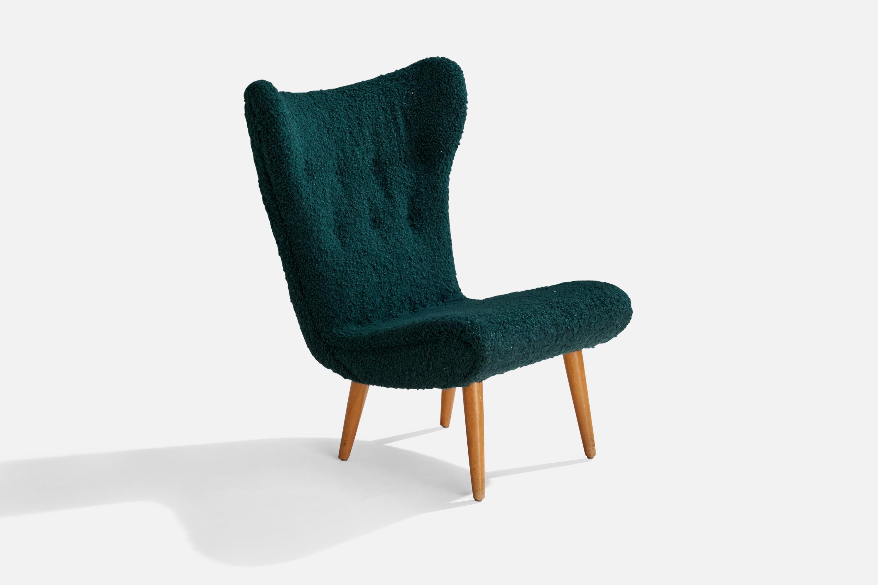 A wood and blue bouclé fabric slipper lounge chair designed and produced in Sweden, c. 1950s.

Reupholstered in brand new fabric.
Seat height: 16”