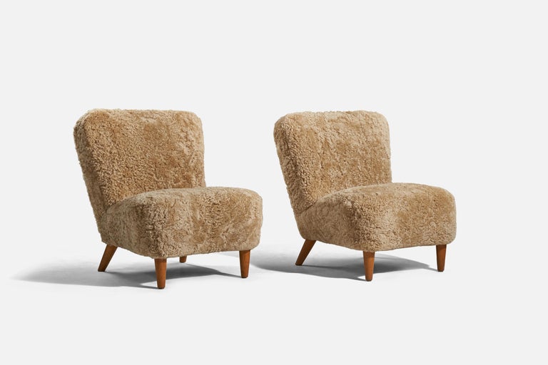 Scandinavian Modern Swedish Designer, Slipper Chairs, Sheepskin, Wood, Sweden, 1940s For Sale