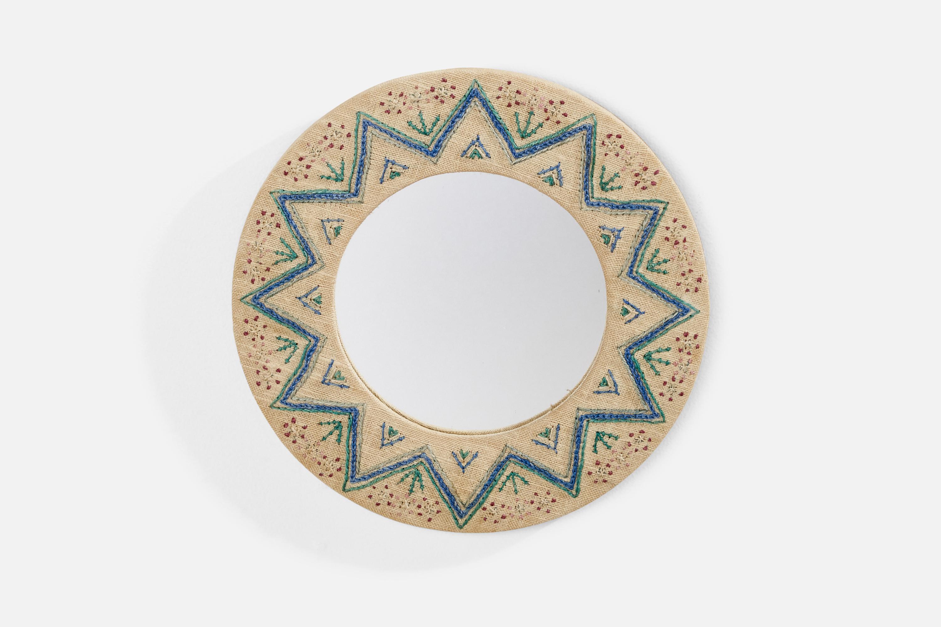 A small hand-embroidered fabric wall mirror designed and produced in Sweden, c. 1970s.
