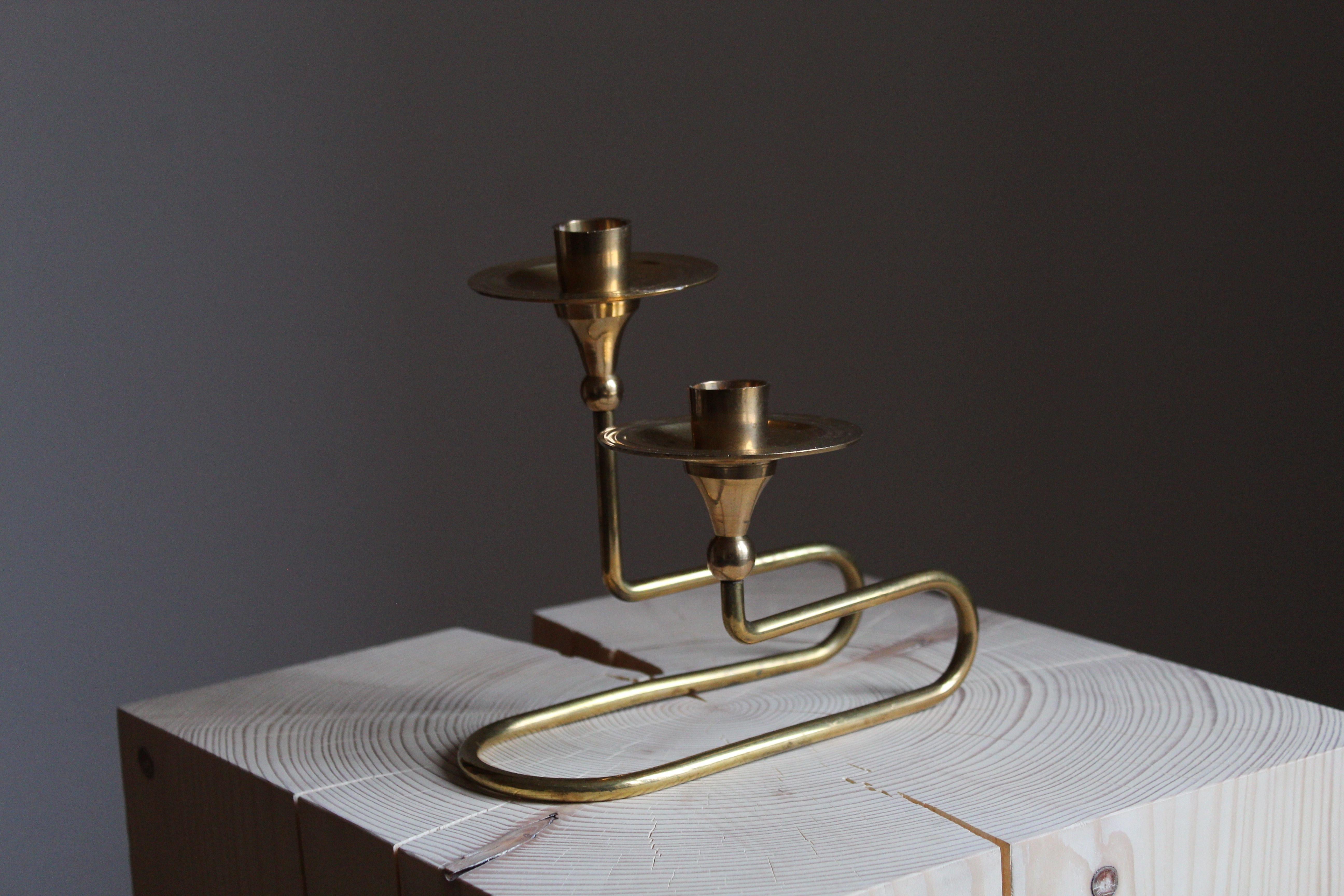 A small organic candlestick, candleholder, Sweden, 1950s. In brass

Other designers of the period include Piet Hein, Paavo Tynell, Josef Frank, and Jean Royere.

 