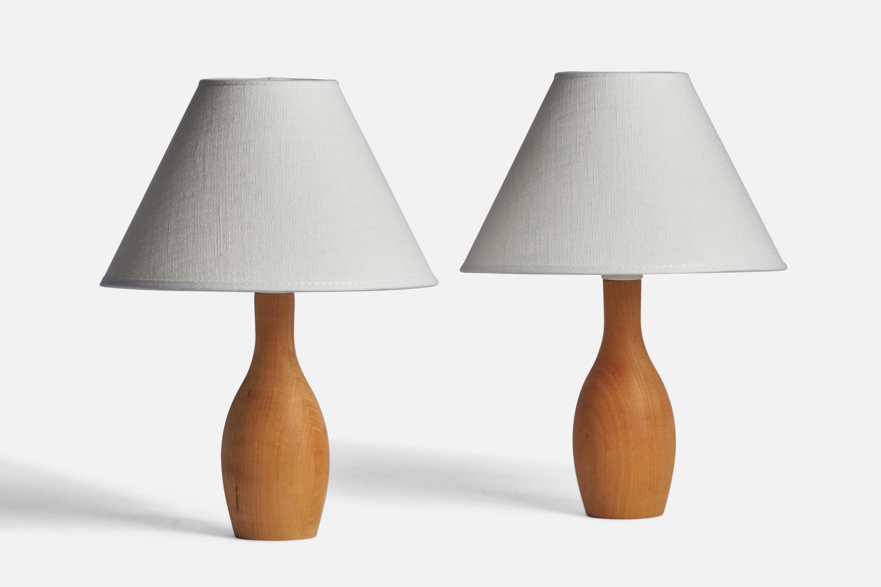 A pair of small oak table lamps designed and produced in Sweden, 1970s.

Dimensions of Lamp (inches): 8.25” H x 2.75” Diameter
Dimensions of Shade (inches): 3” Top Diameter x 8” Bottom Diameter x 5.4” H
Dimensions of Lamp with Shade (inches): 11” H
