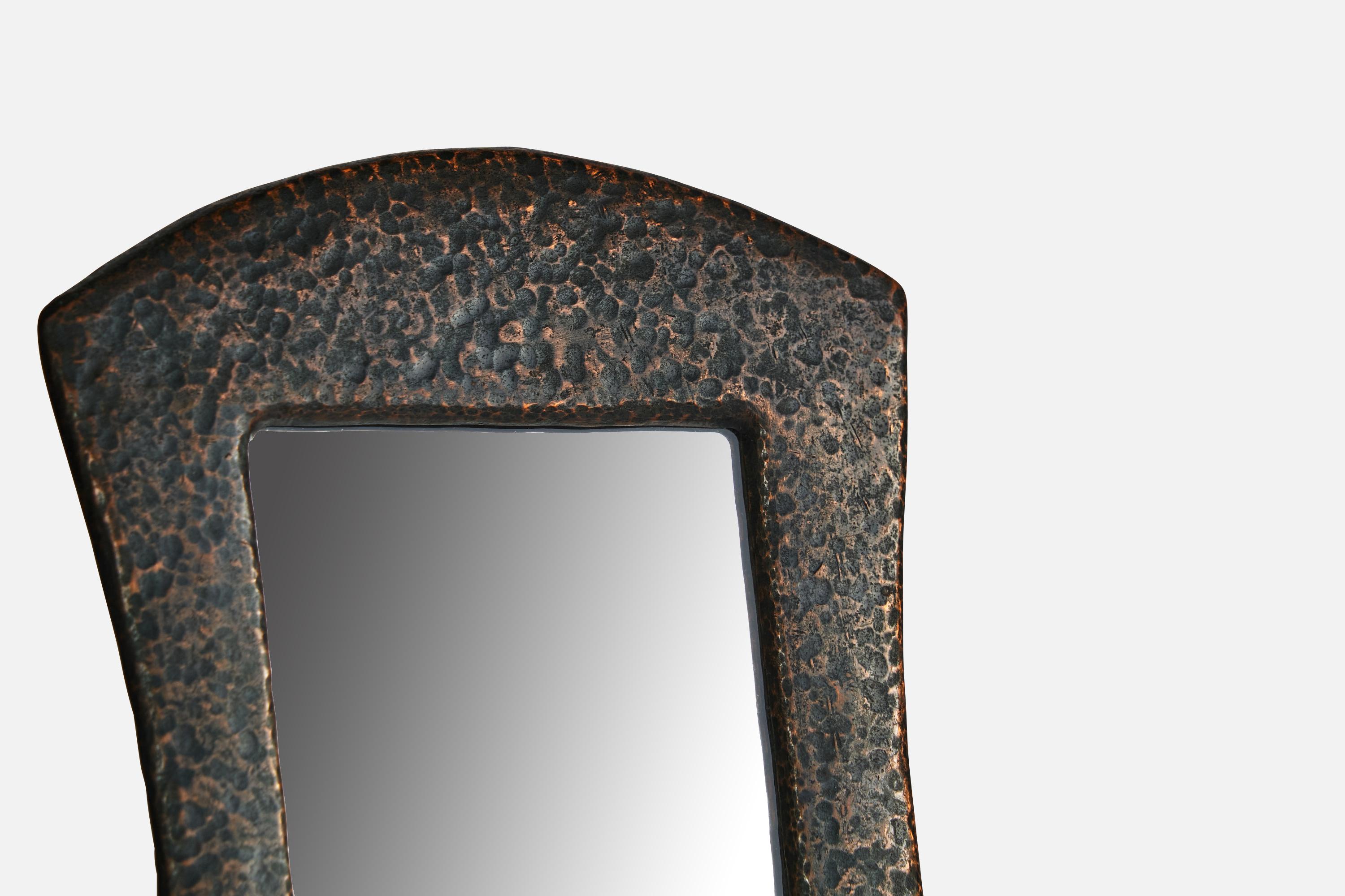 A hammered and darkened copper mirror designed and produced in Sweden, c. 1920s.