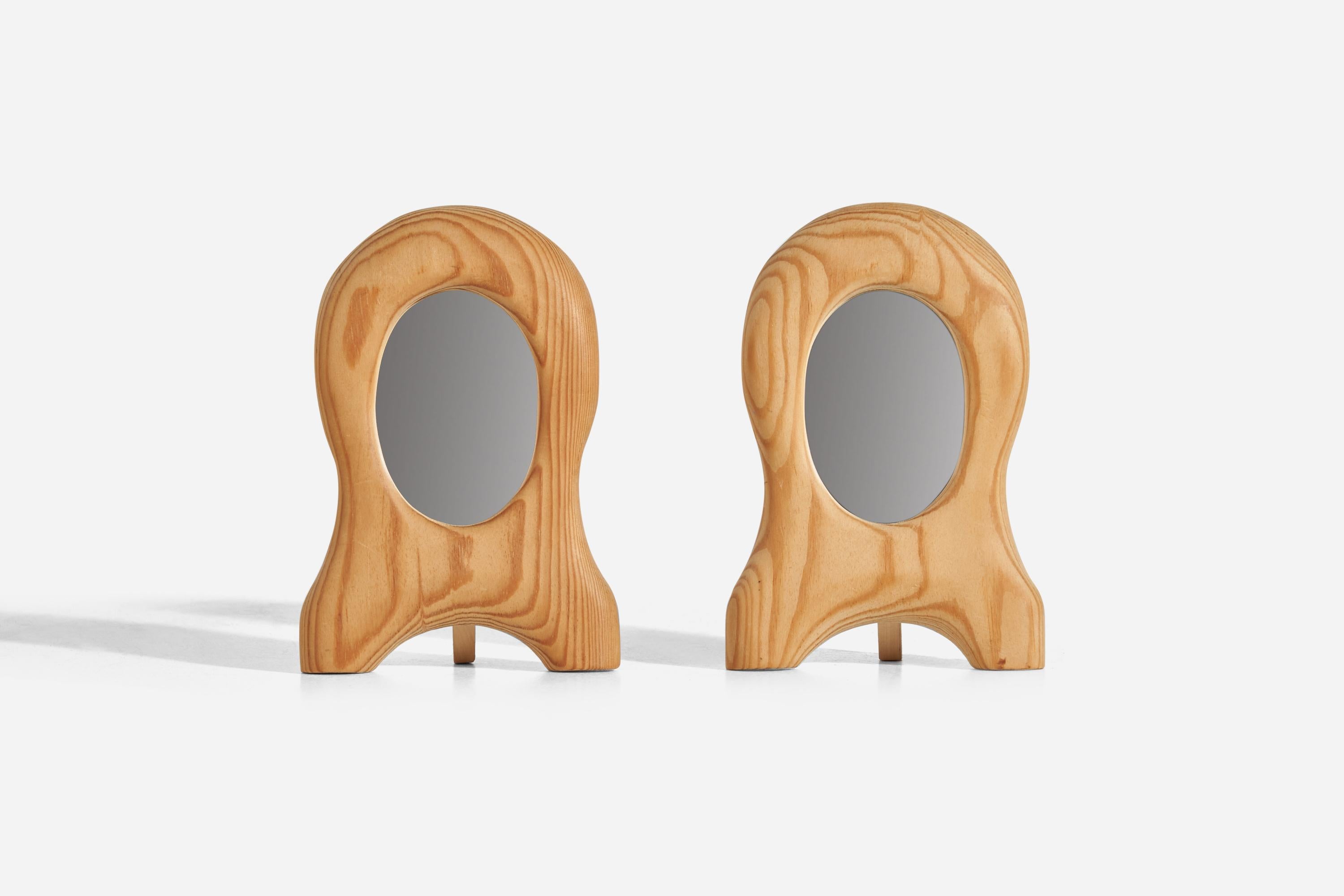 A pair of pine table mirrors designed and produced in Sweden, 1960s.