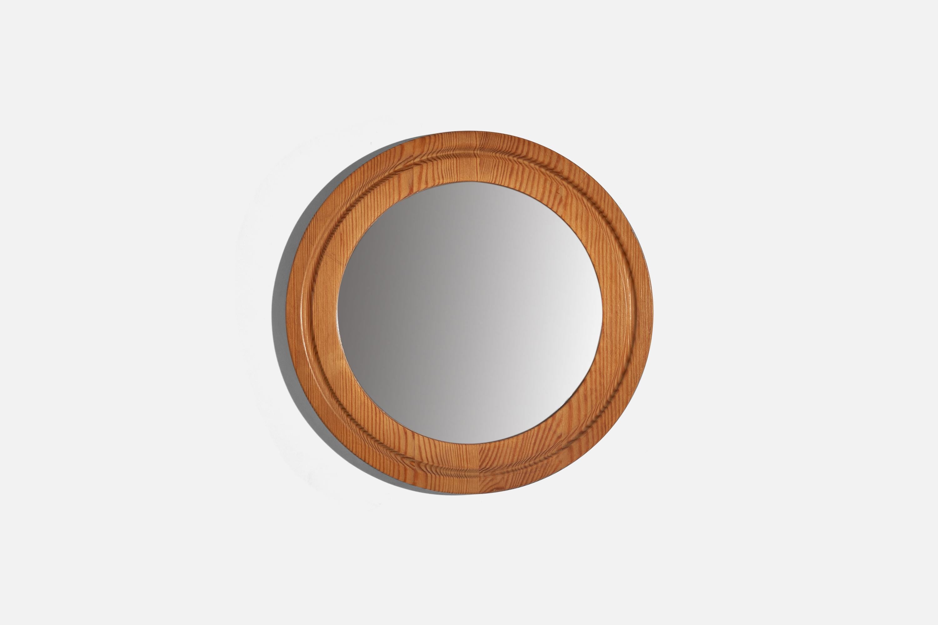 A pine wall mirror designed and produced in Sweden, 1970s.
  
