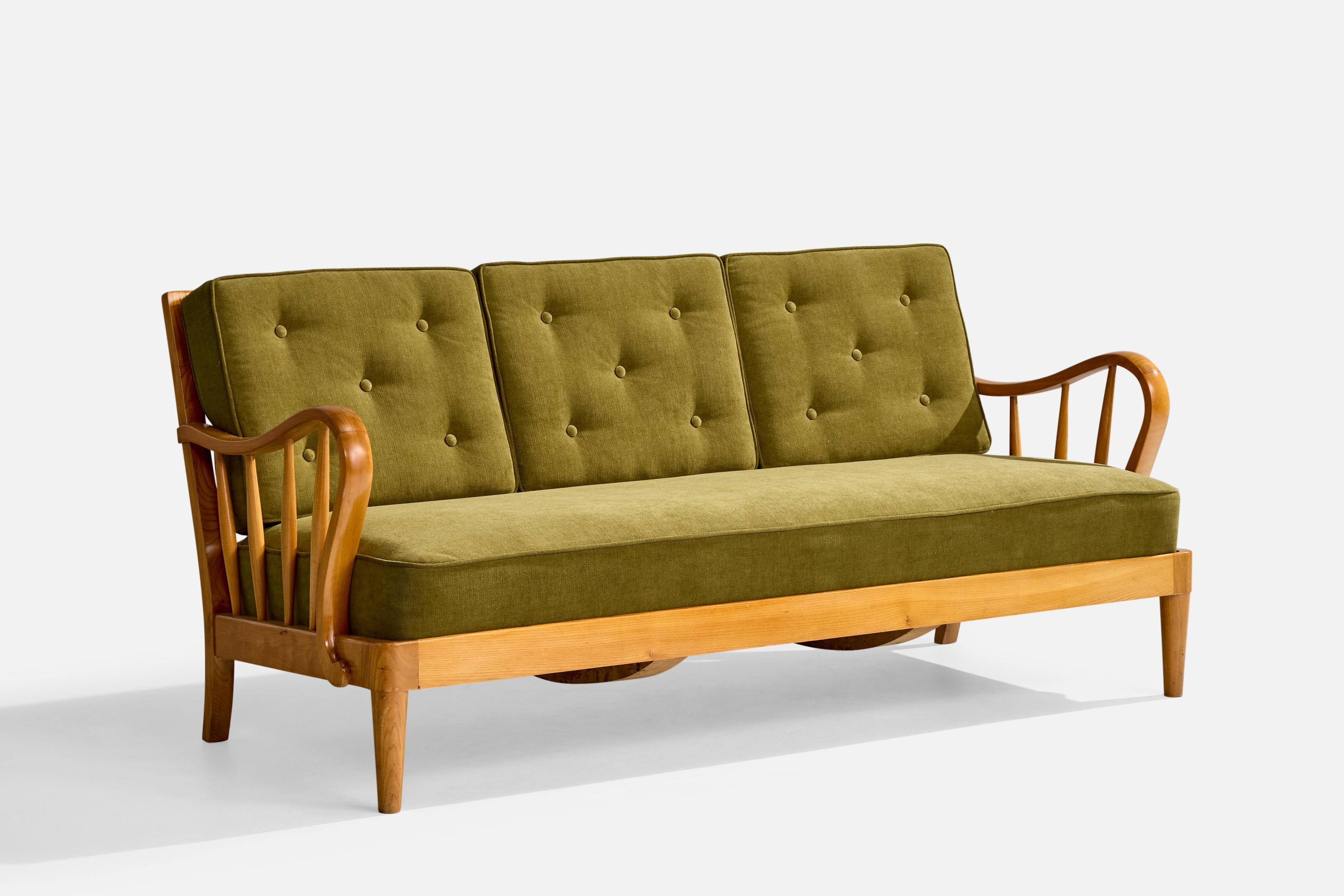 An elm, beech and green fabric sofa designed and produced in Sweden, c. 1940s.

Reupholstered in a brand new fabric.

Overall Dimensions (inches): 31.5