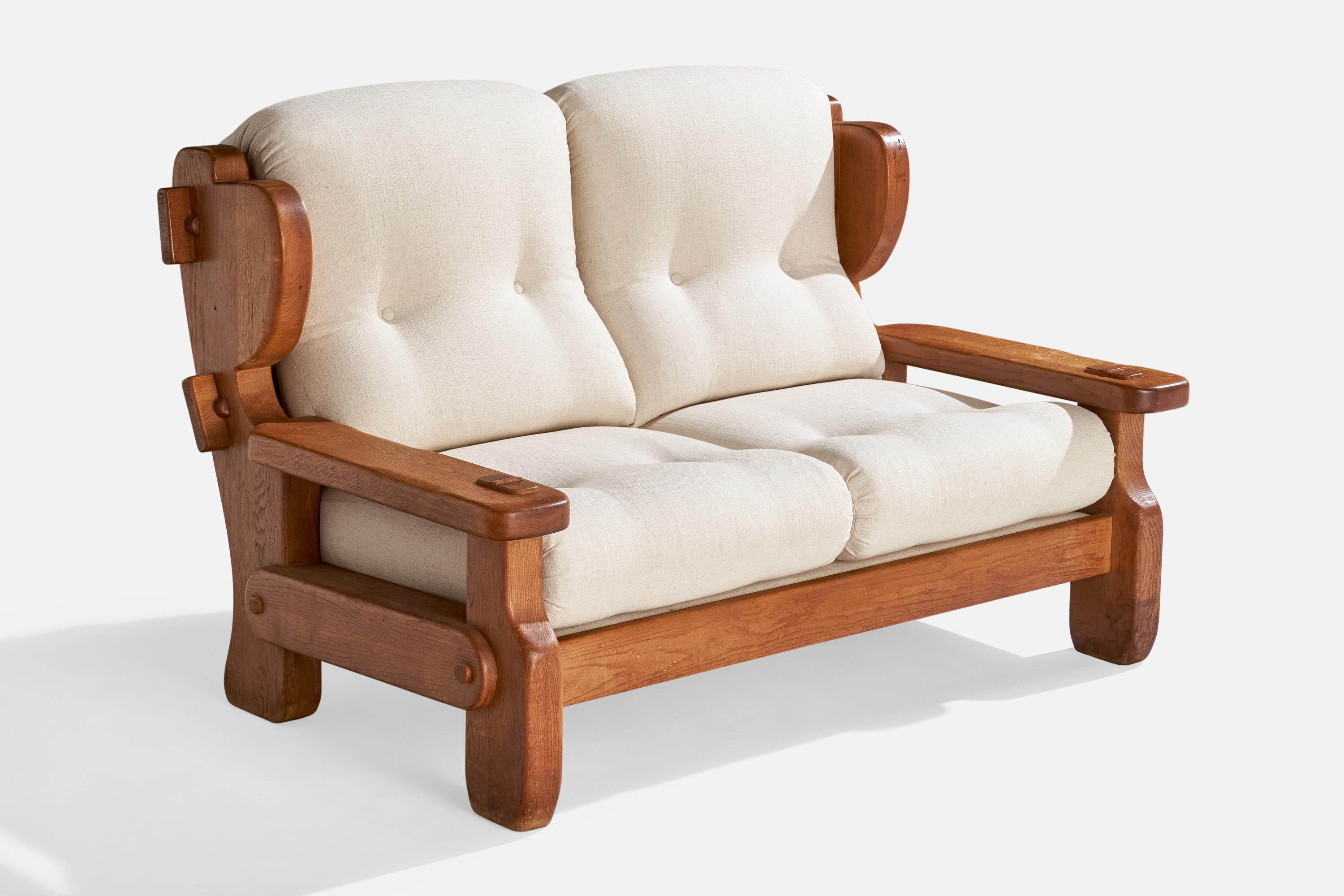 A pine and white fabric sofa designed and produced in Sweden, c. 1970s.

Dimensions: 38” H x 57.25” W x 34.25” D 

Seat height: 17.5”