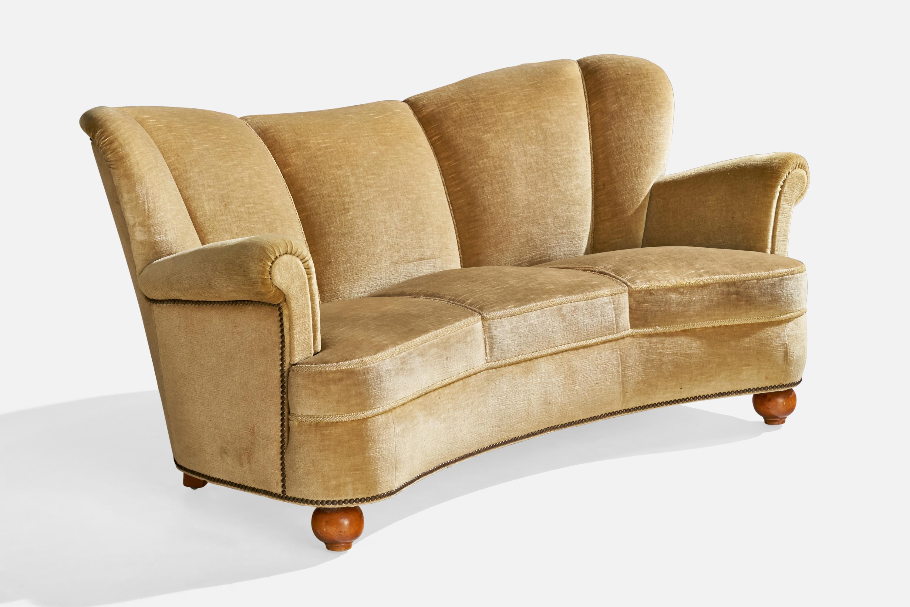 A yellow velvet and wood sofa designed and produced in Sweden, c. 1930s.

Seat height: 16.25