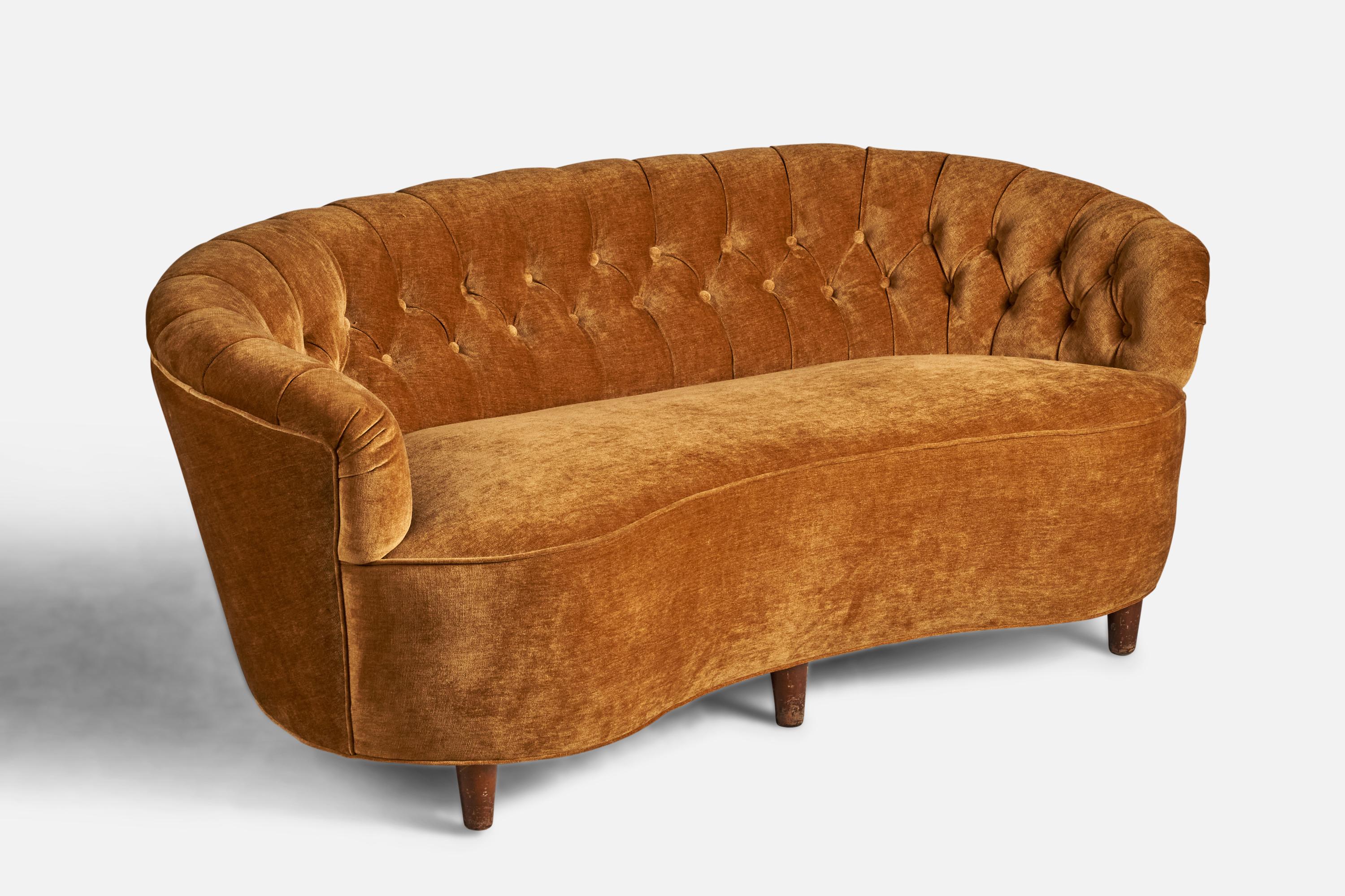 A stained wood and beige orange velvet sofa designed and produced in Sweden, 1930s.
18.5” seat height