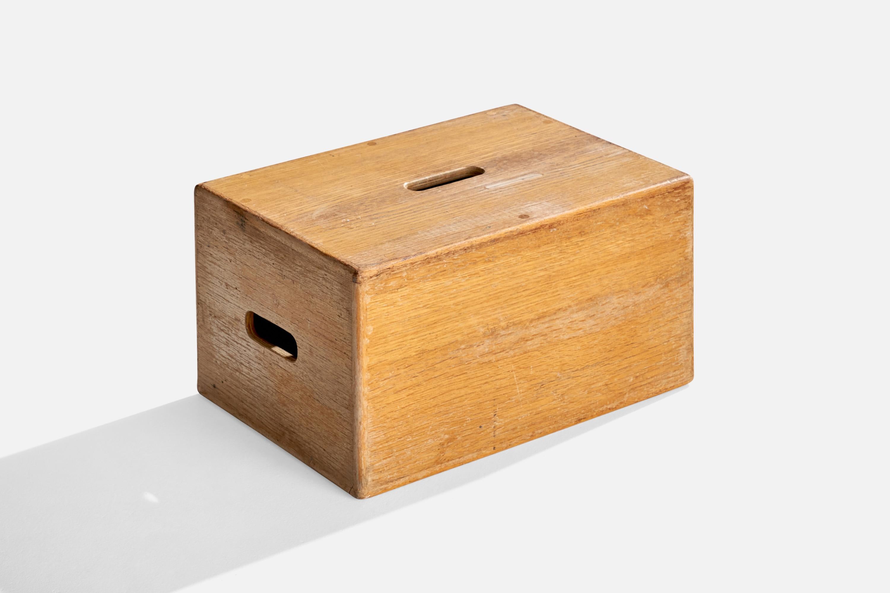 An oak stepping stool produced in Sweden, c. 1950s.

