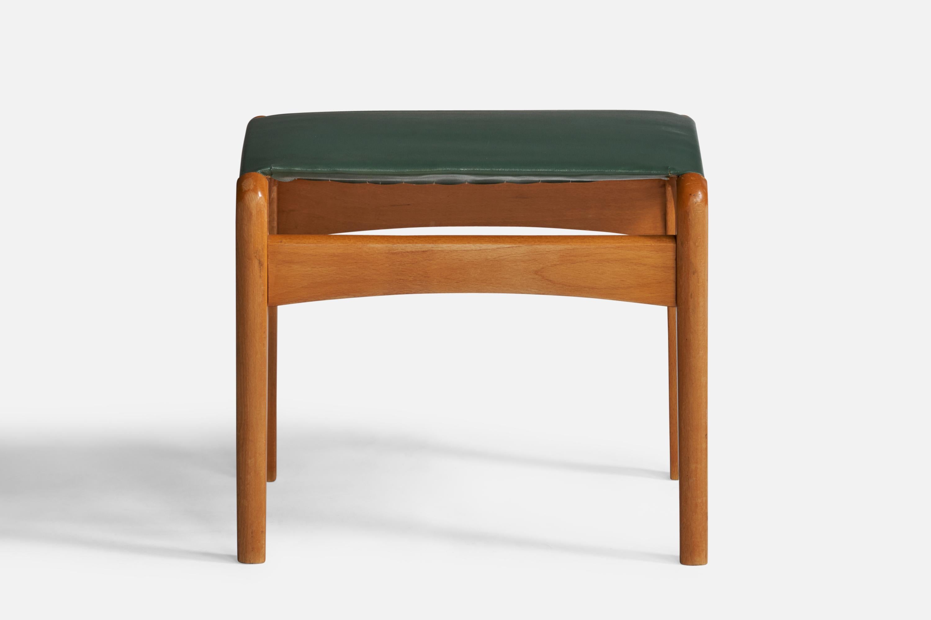 A green leather and beech stool designed and produced in Sweden, c. 1950s.

Seat height: 15.5”