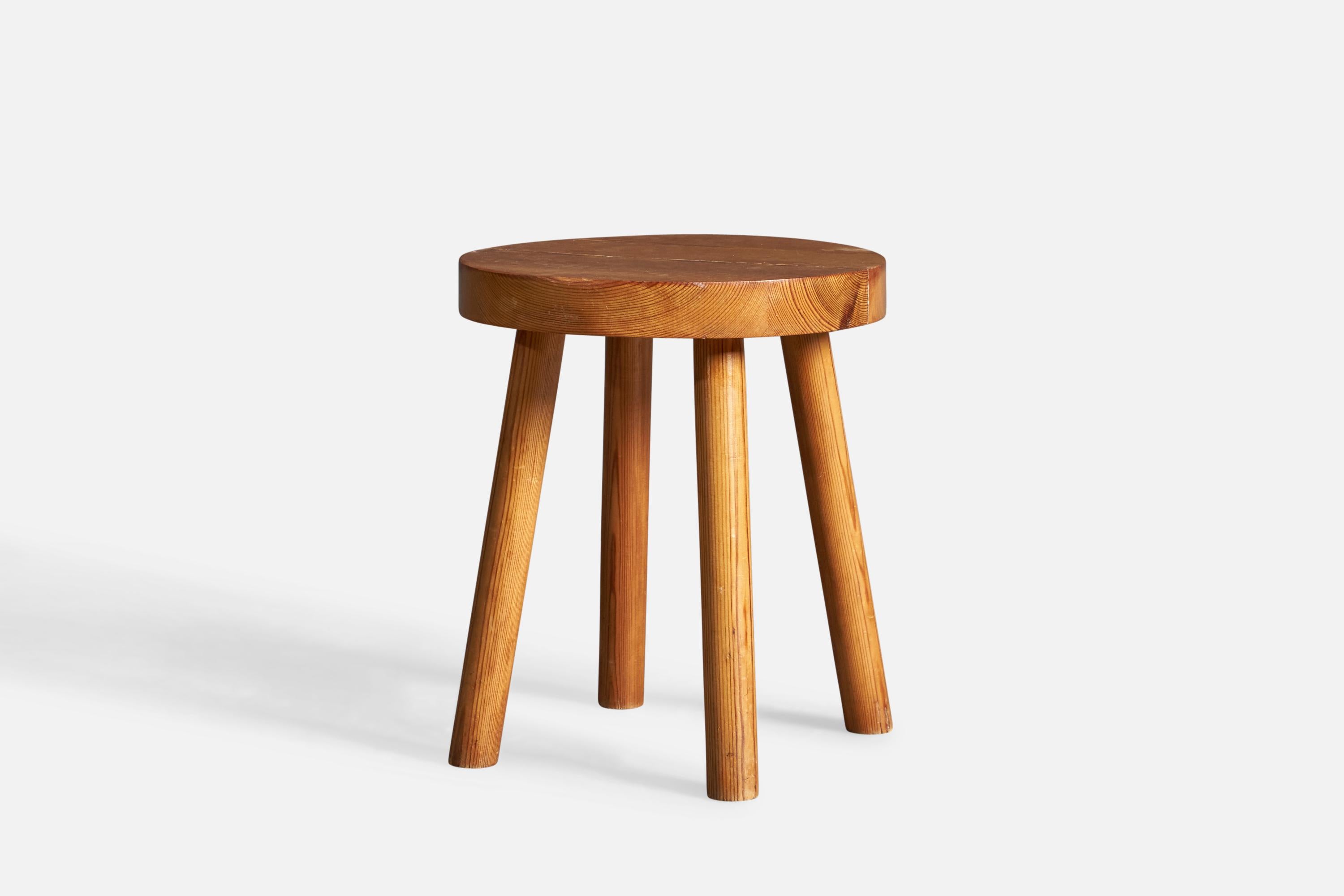 A solid pine stool, designed and produced in Sweden, circa 1970s.