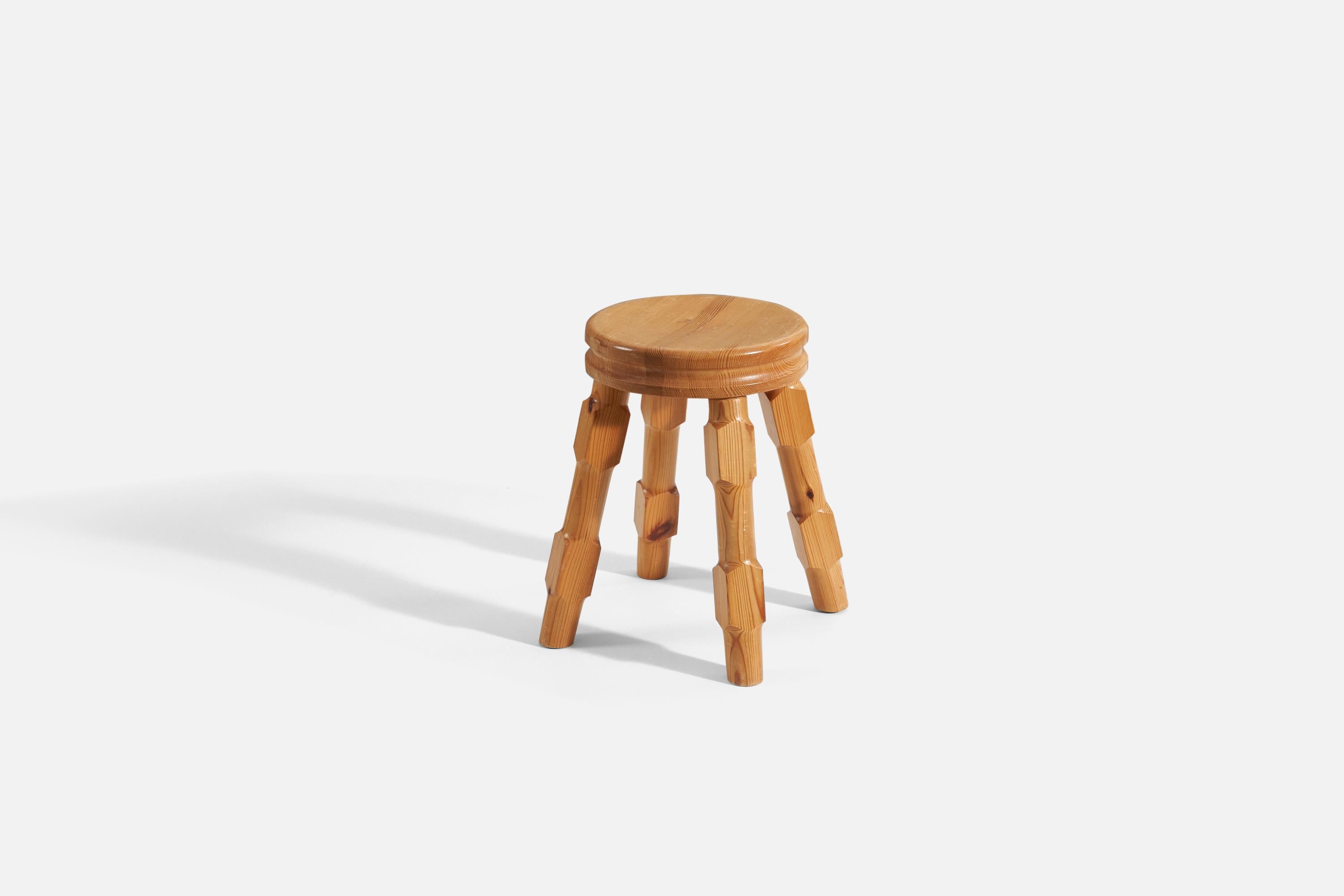 A solid turned pine stool produced in Sweden, 1983. Signed and dated to underside.