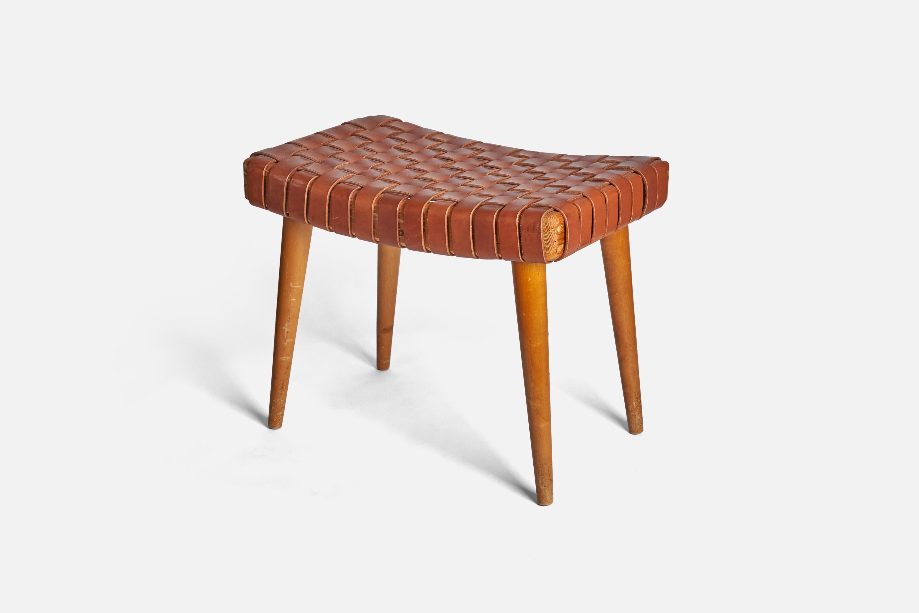 A solid pine and leather stool designed and produced in Sweden, 1950s. 

