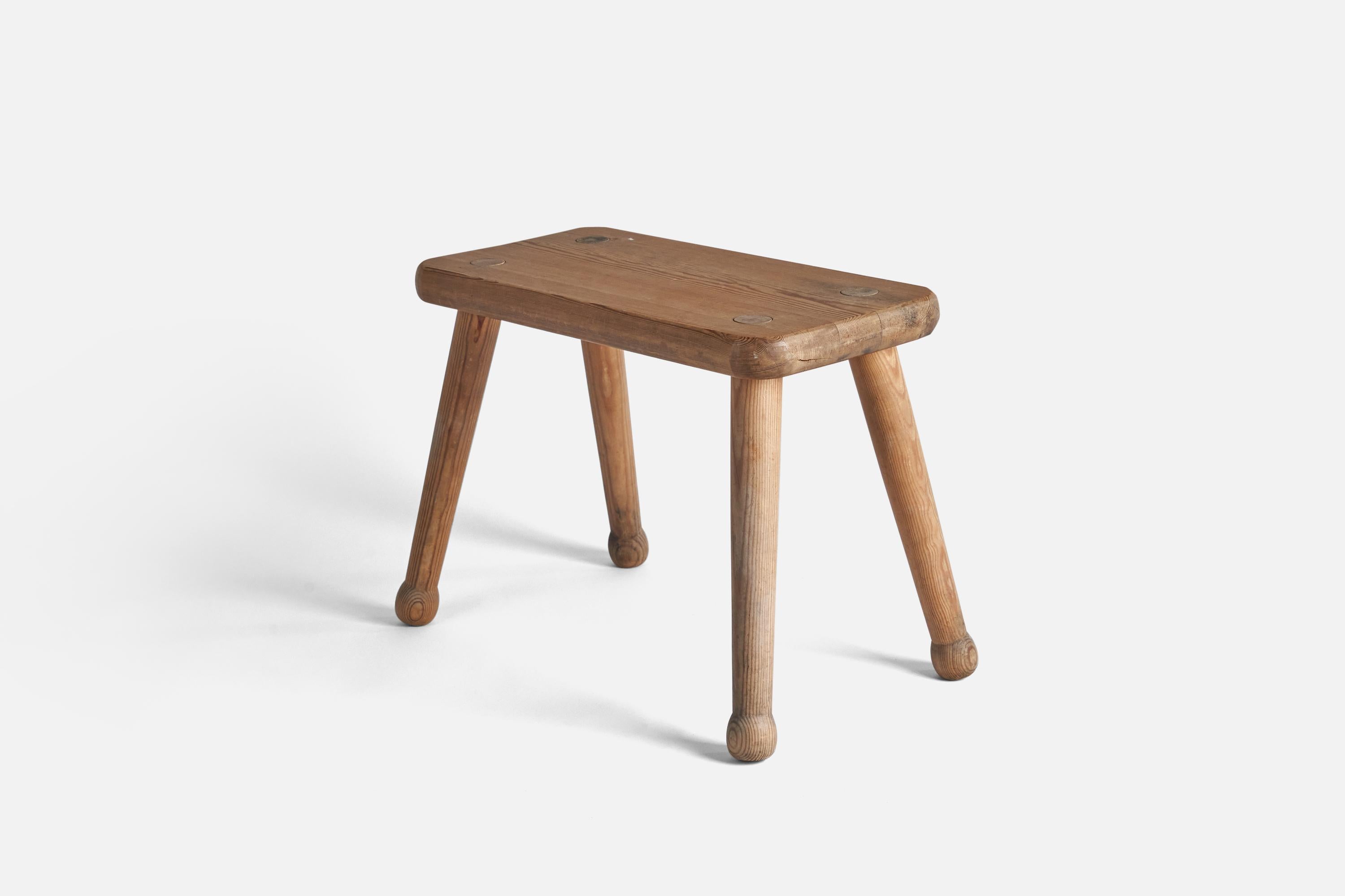 A solid pine stool designed and produced in Sweden, 1940s. 